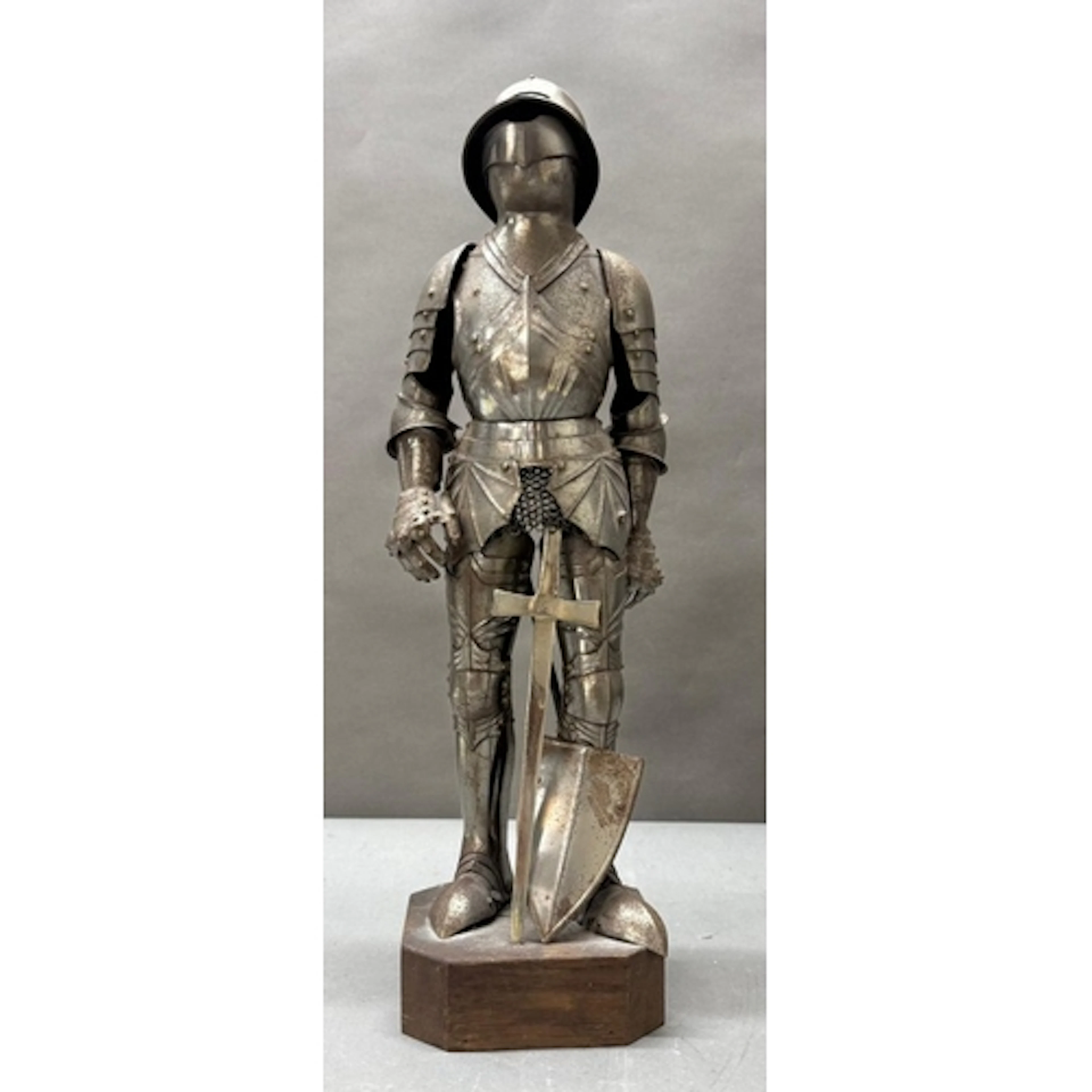 A scale suit of armour on plinth in the style of a 16th cent...