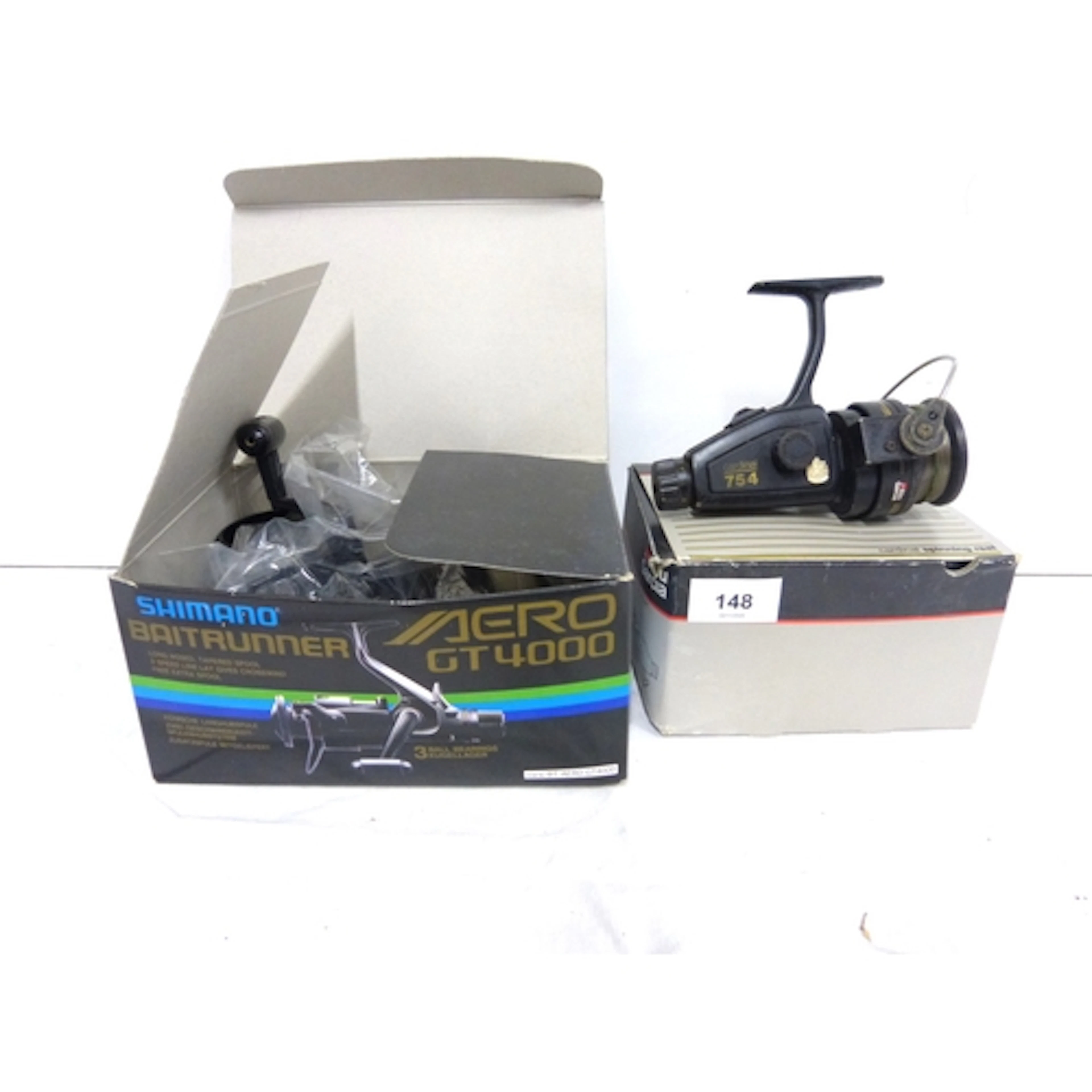 Shimano bait runner and Abu Cardinal 754 spinning reels, box...