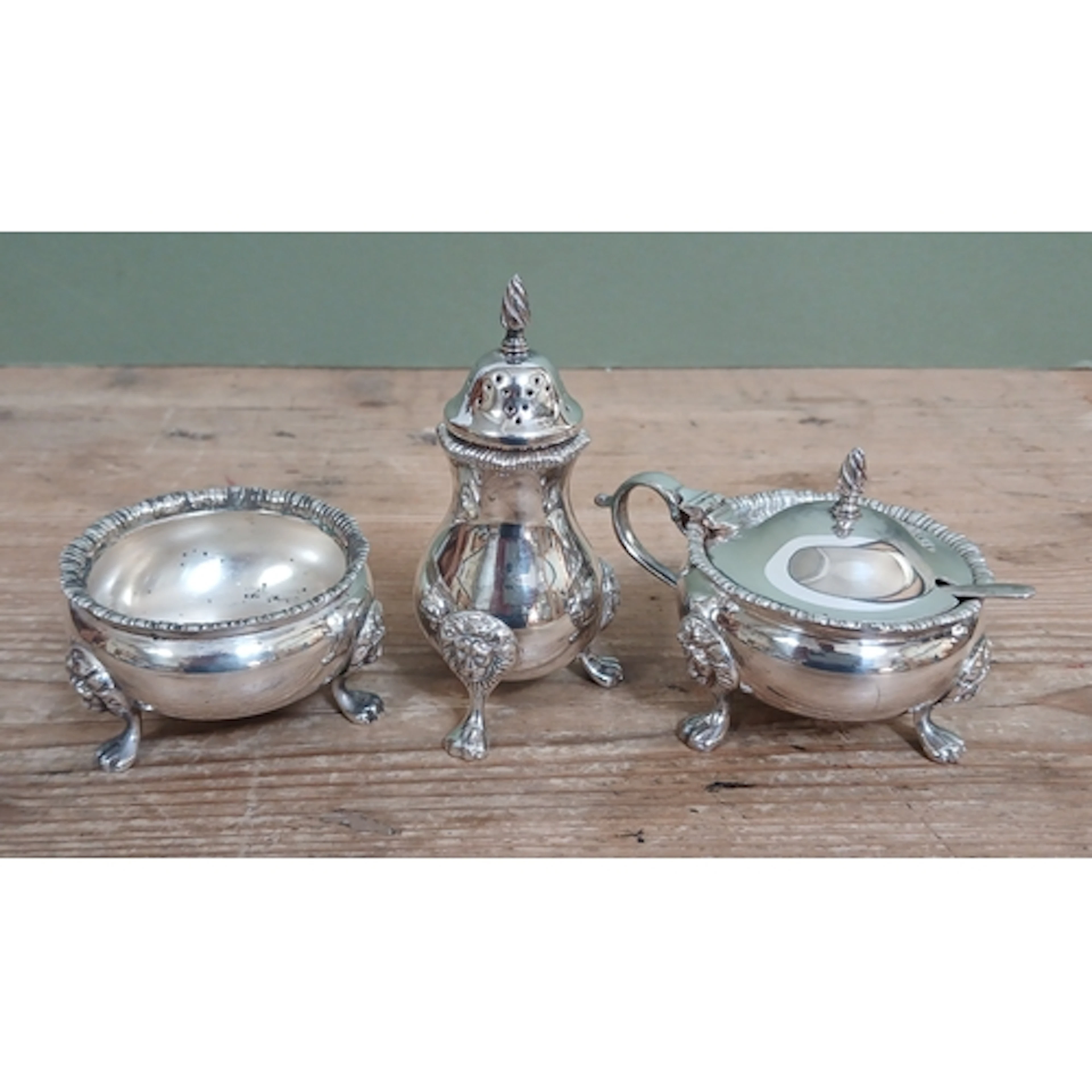 An Elizabeth II three piece silver cruet, Roberts & Belk Ltd...