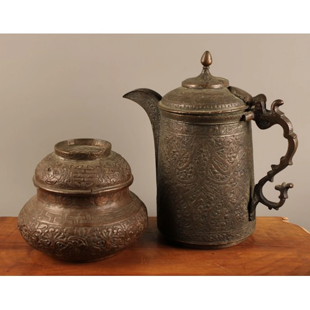 A 19th century Kashmiri flagon or coffee pot profusely chase...