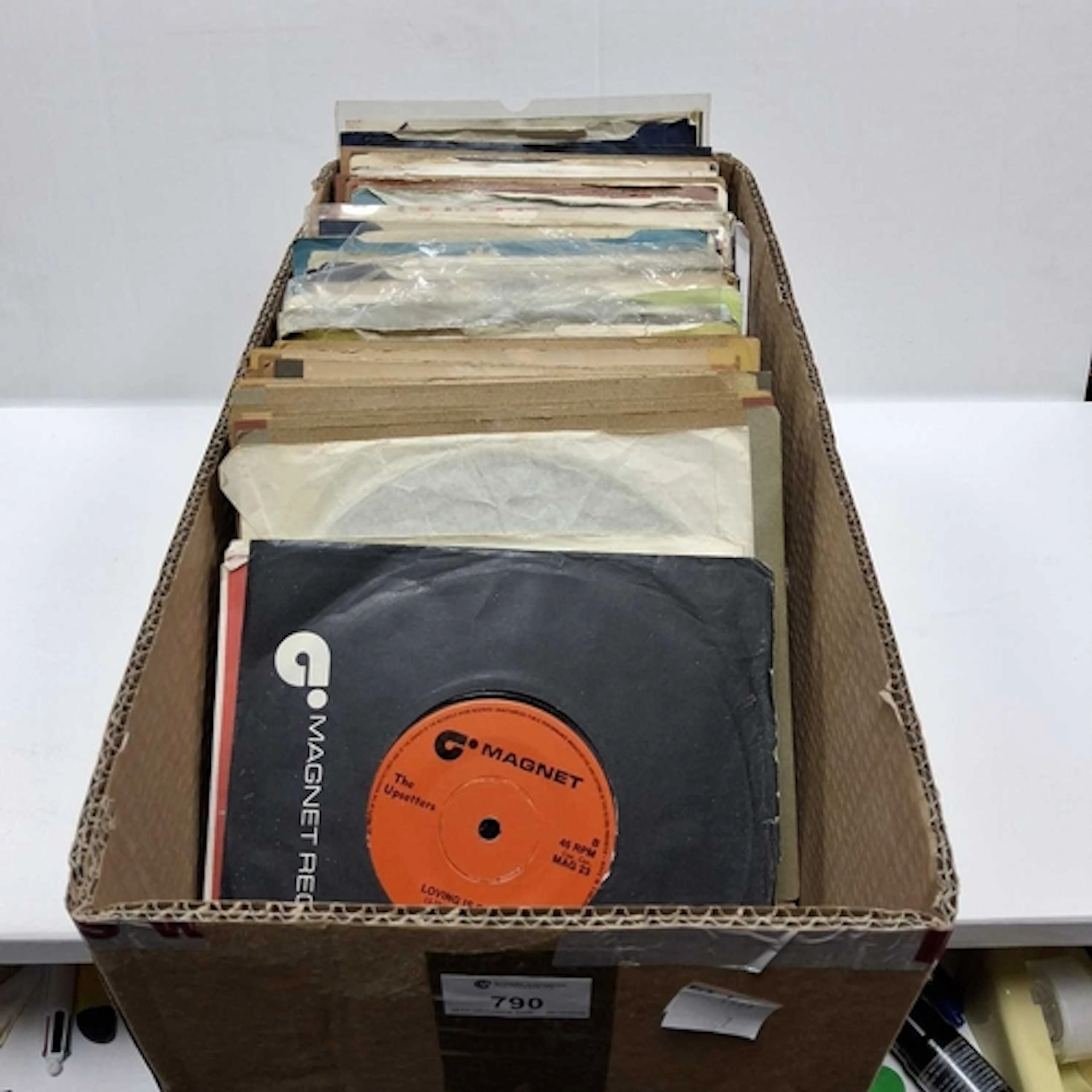 ONE BOX OF 45 R.P.M SINGLES, approximately eighty singles, a...