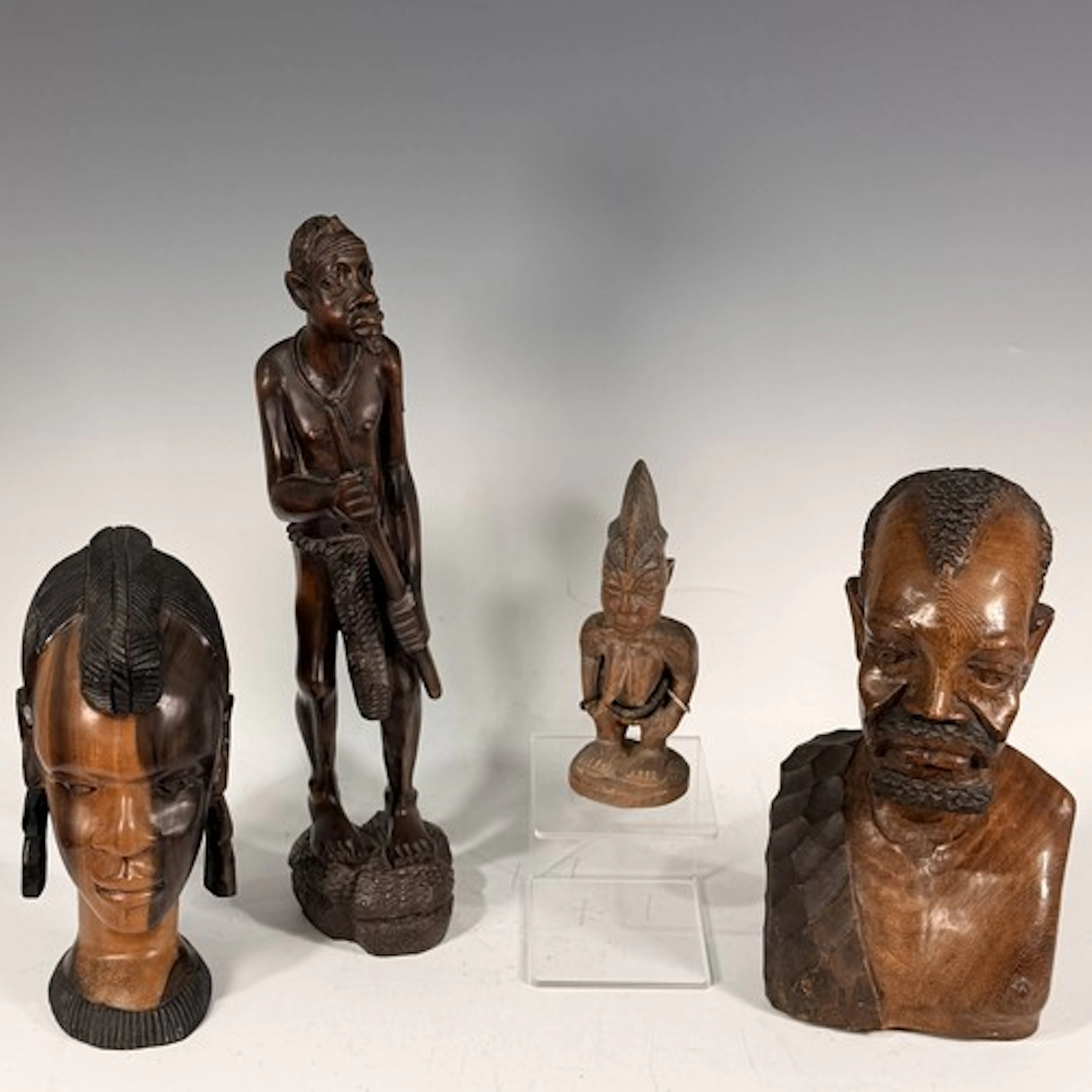 Tribal Artefacts; a Yoruba ibeji female figure, adorned with...