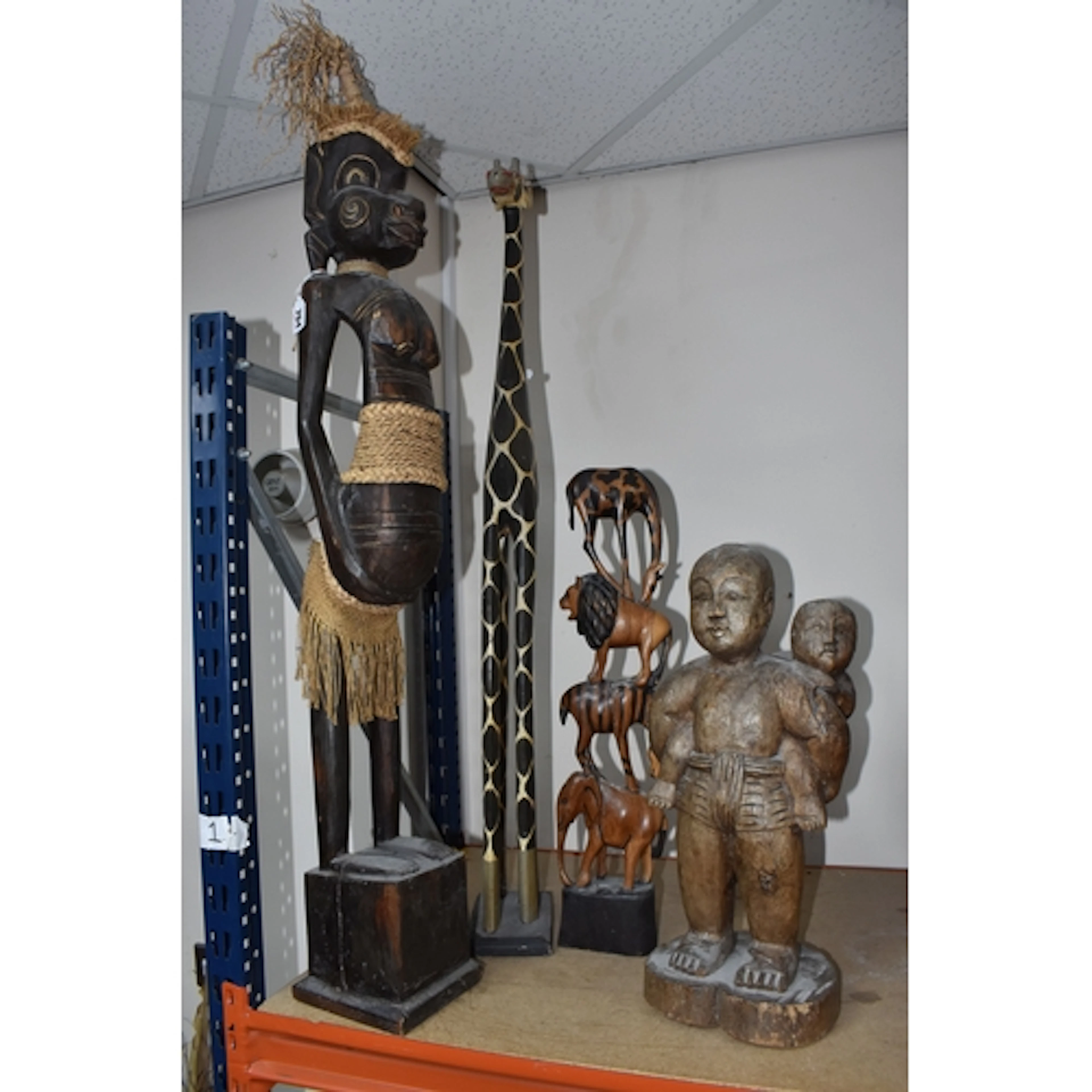 A GROUP OF FOUR AFRICAN ETC SCULPTURES to include a large ca...