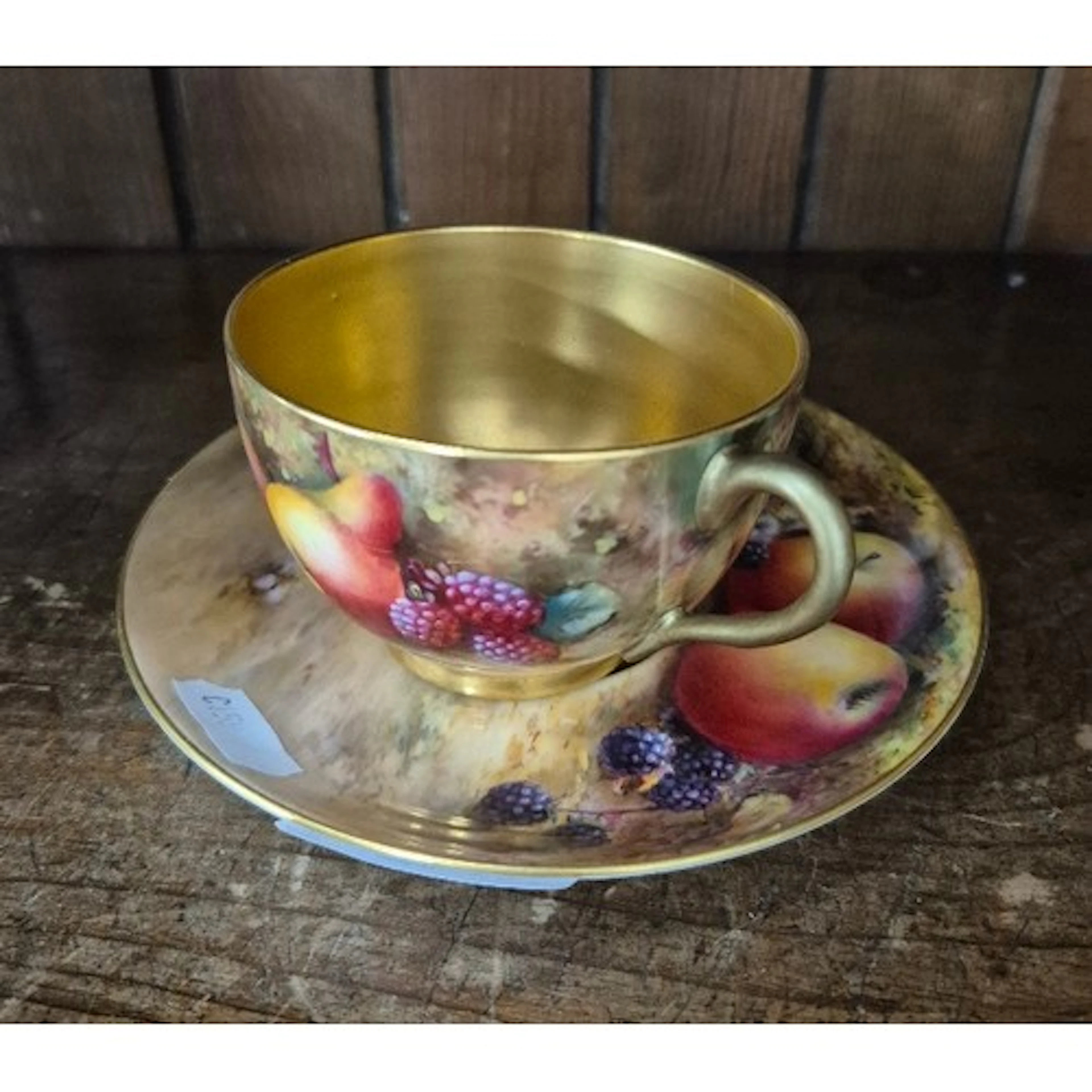 A Royal Worcester cup with painted fruit still life, signed ...
