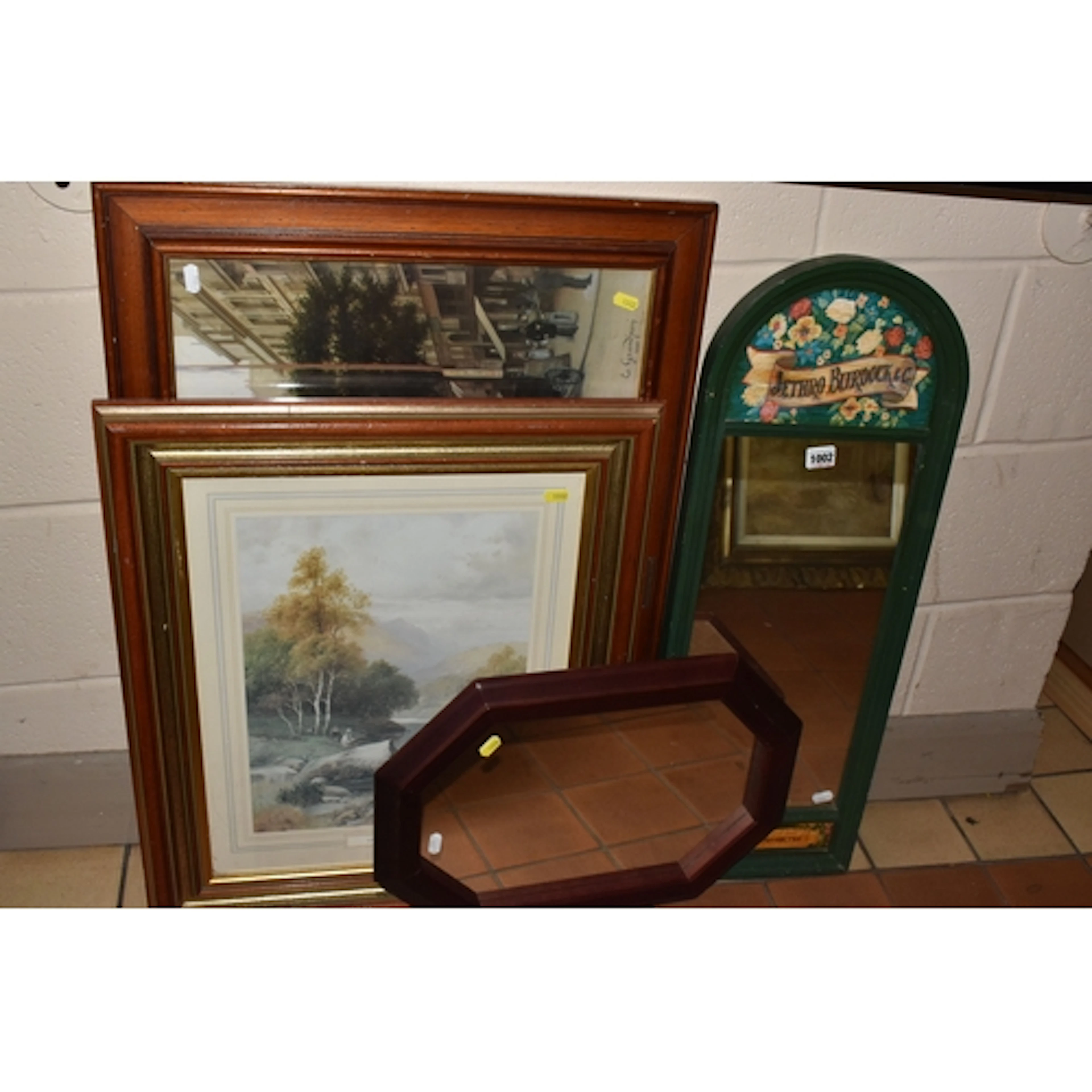 A DECORATIVE WOODEN FRAMED MIRROR, printed detail top and bo...