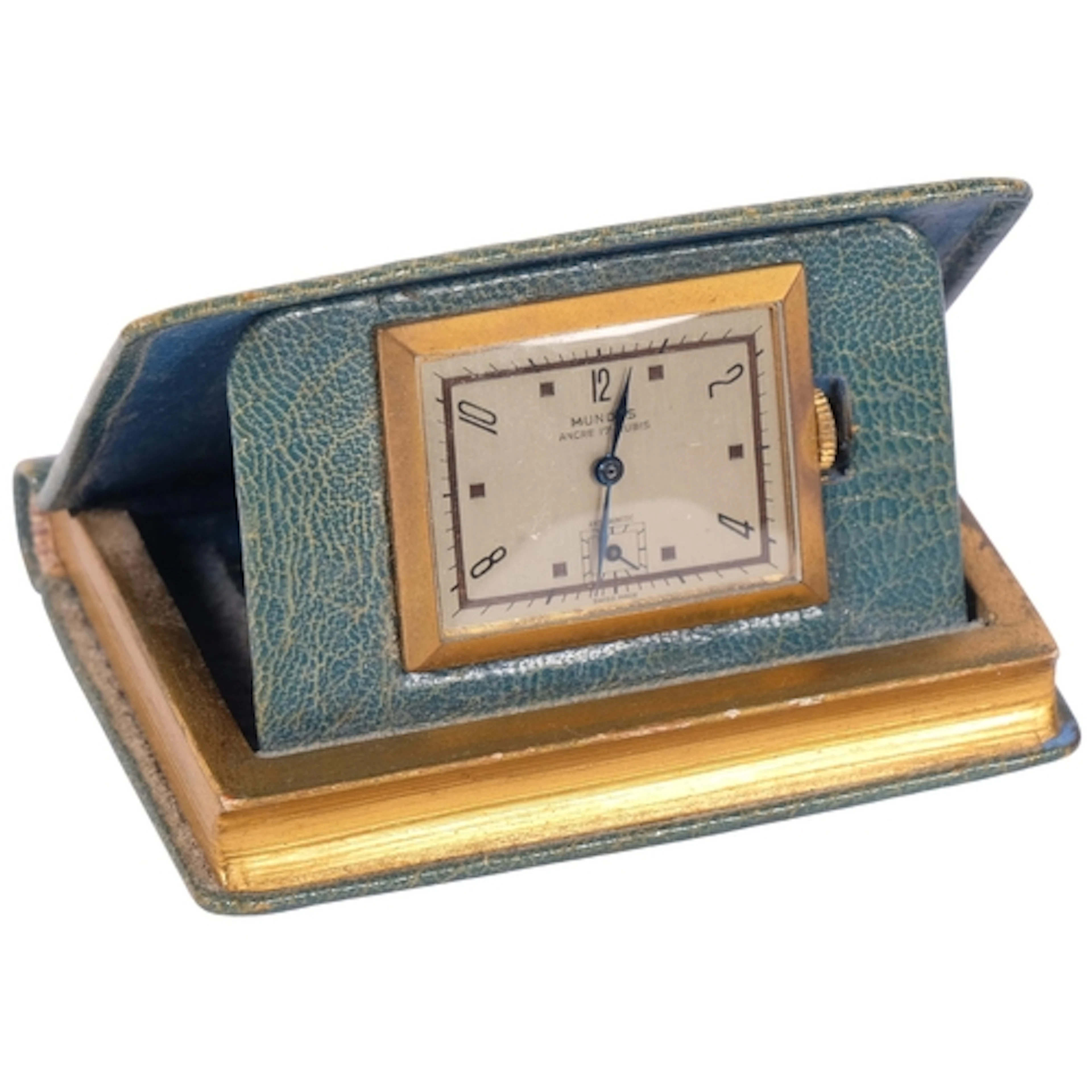 A boxed miniature leather-covered Livre d'heures travel cloc...