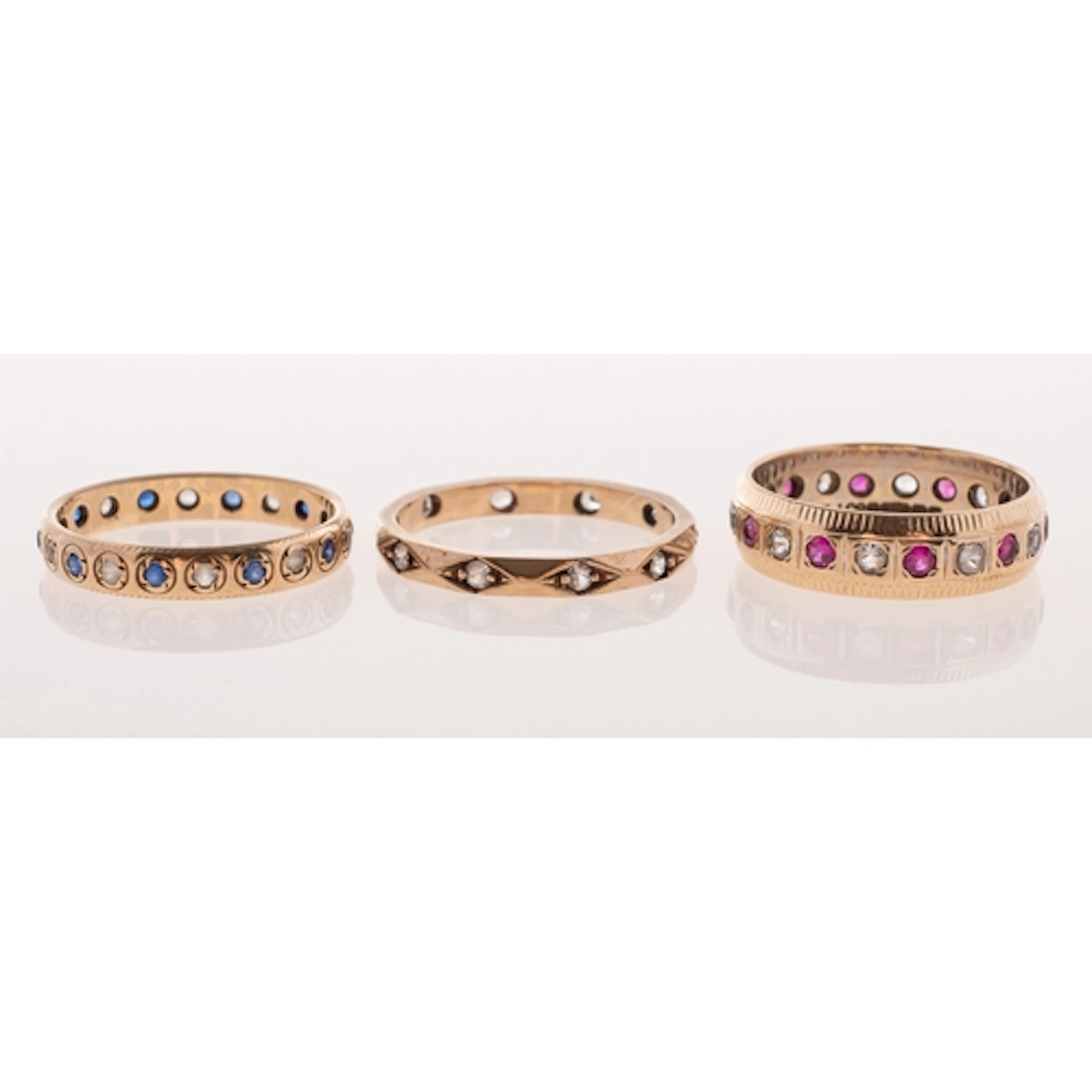 Three vintage varied design full eternity style rings, inclu...