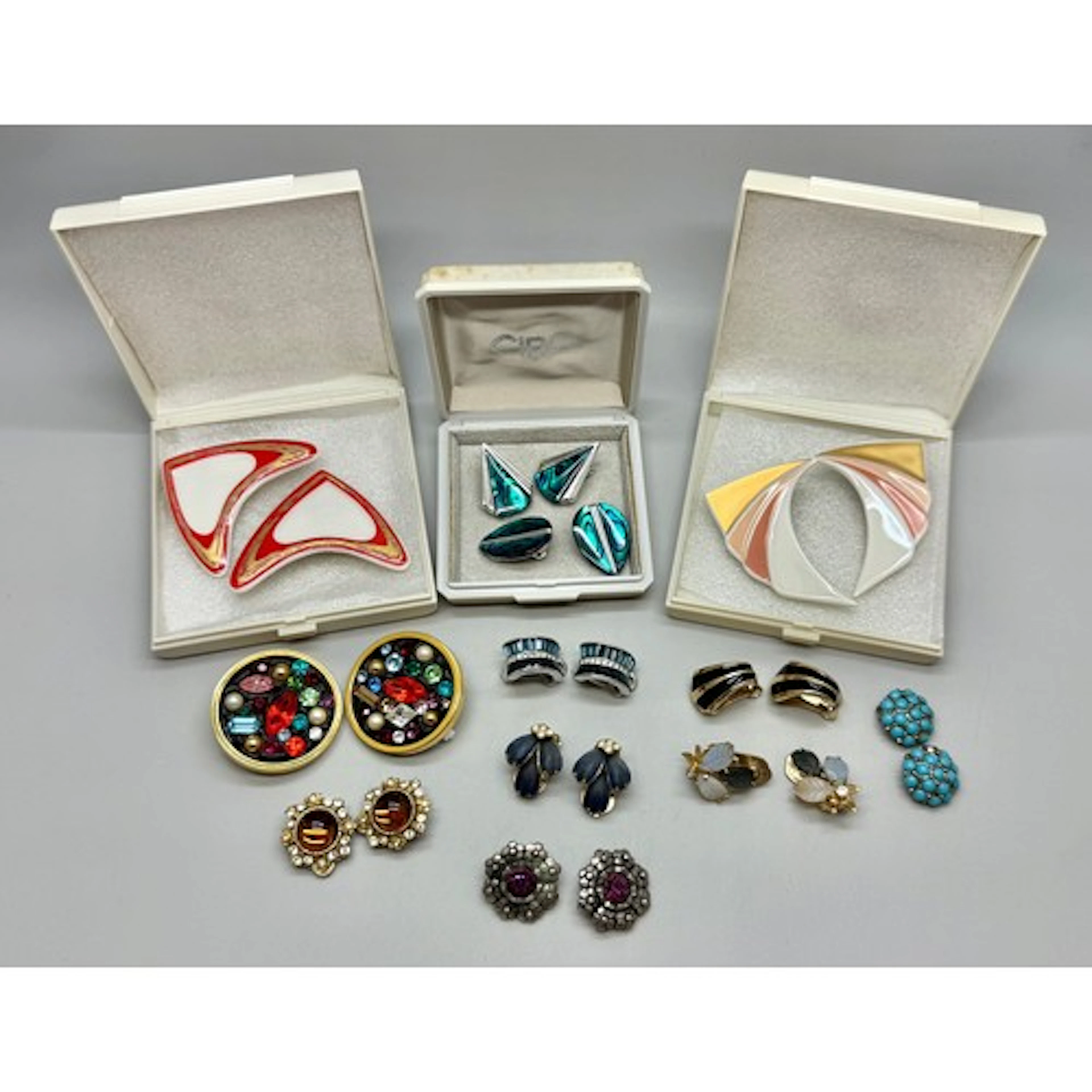 A collection of costume clip on earrings including two pairs...