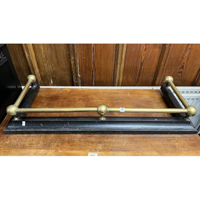 Brass and wrought iron fire fender.
