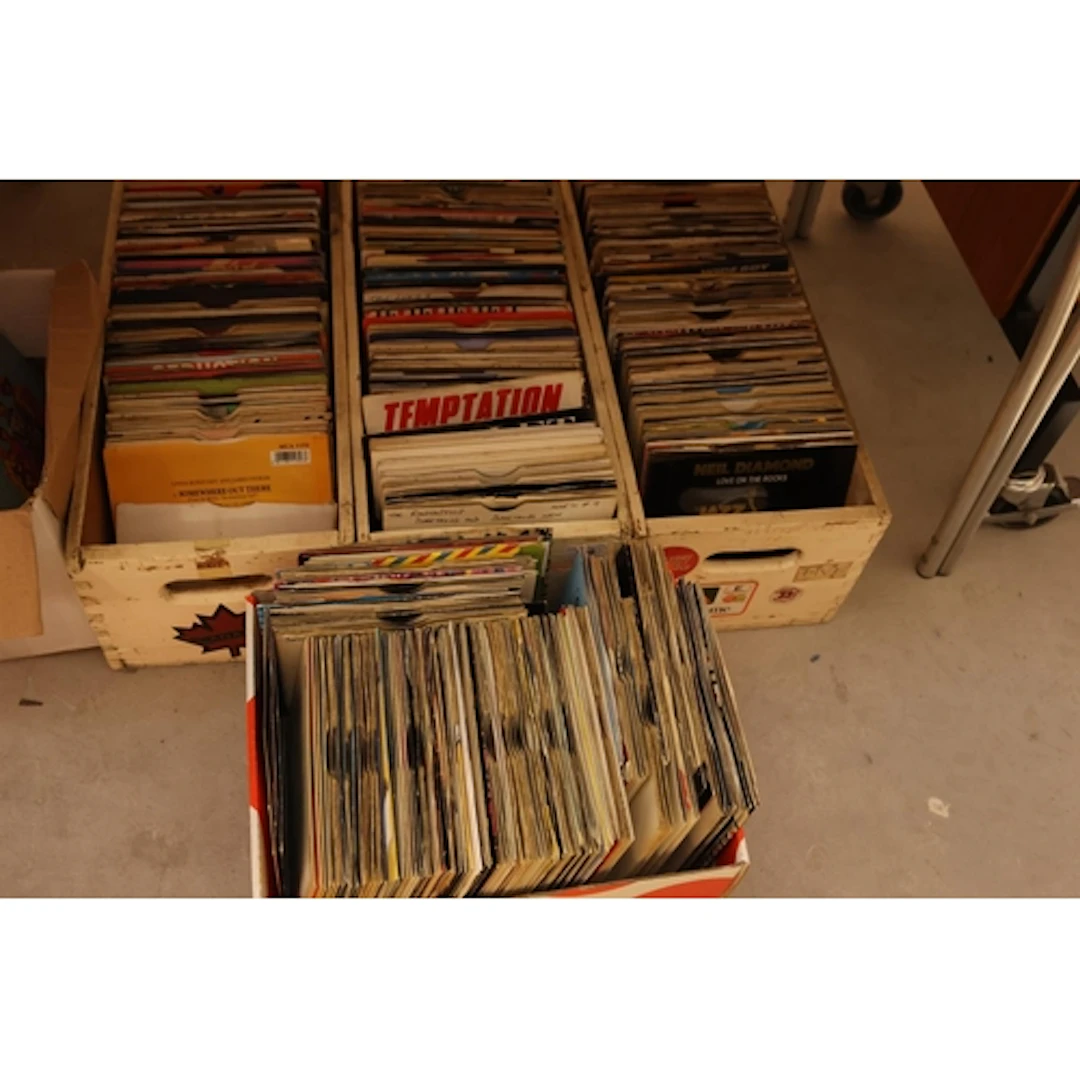 Three crates and a box of mixed 7'' singles