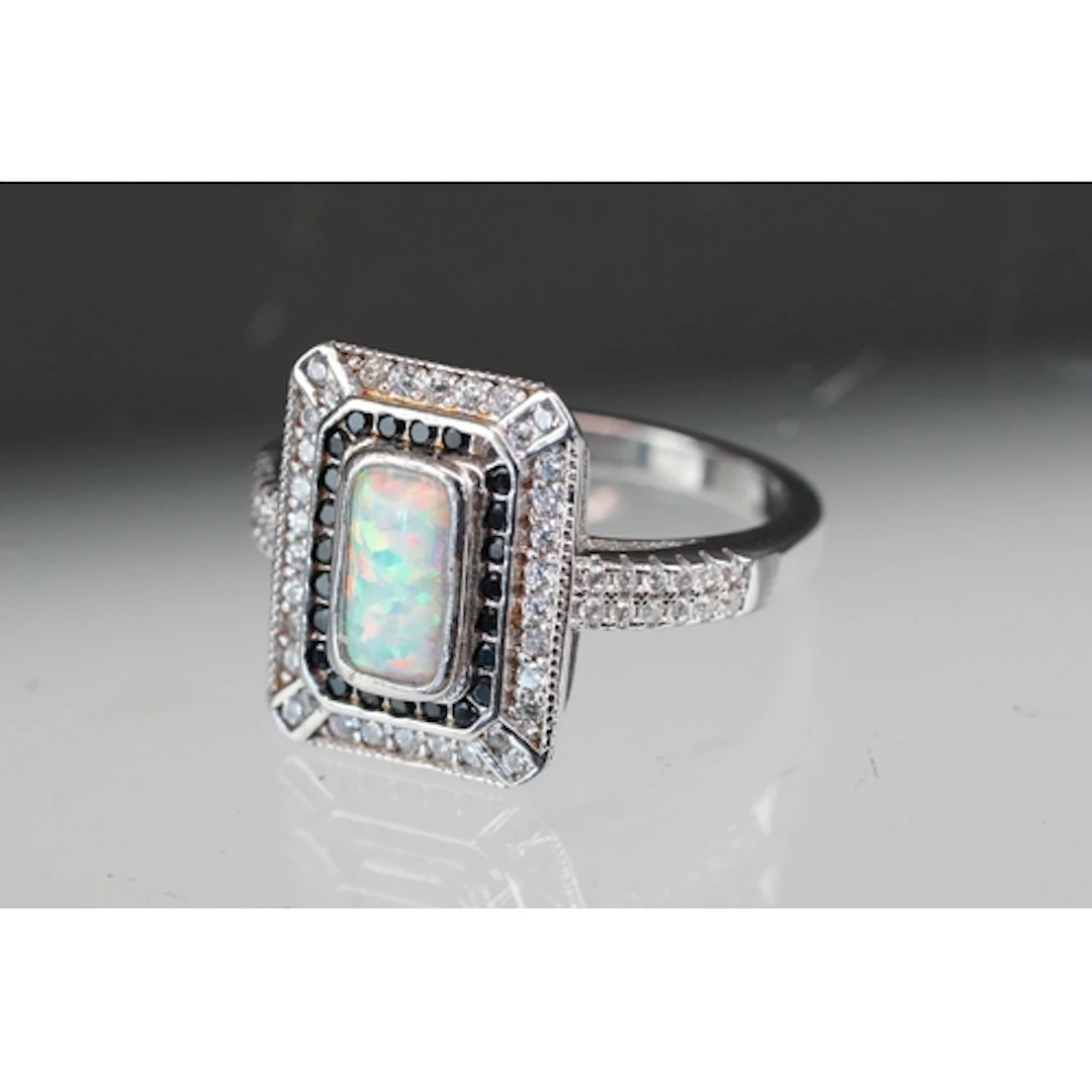 Silver CZ and opal pannelled dress ring