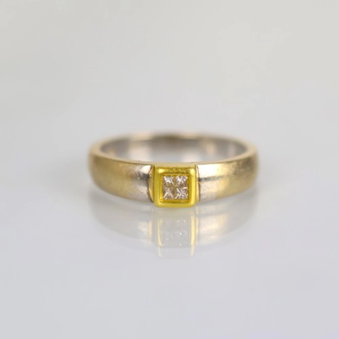 A contemporary 18ct white gold diamond ring, the four diamon...