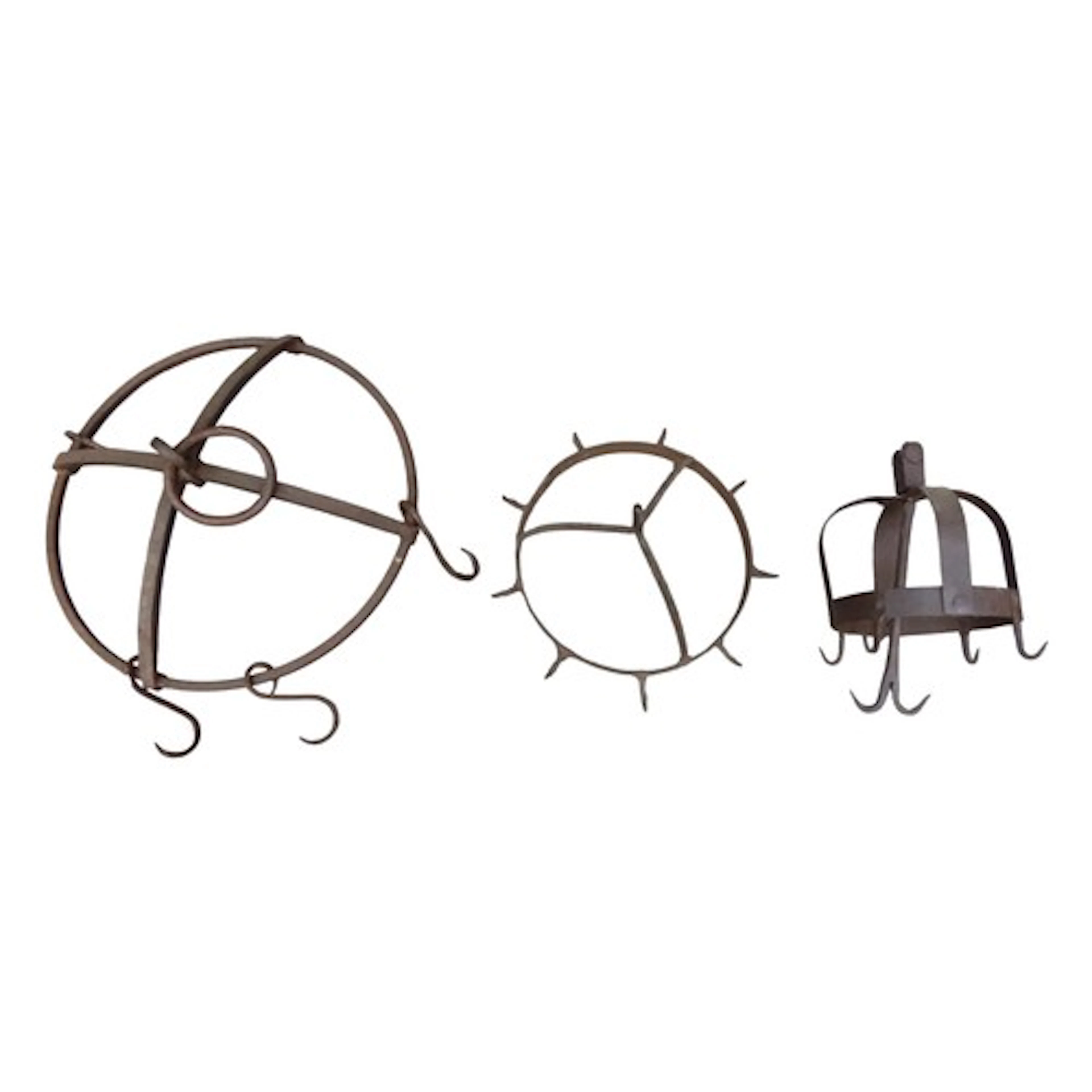 Three vintage iron work game crowns of varying size and desi...