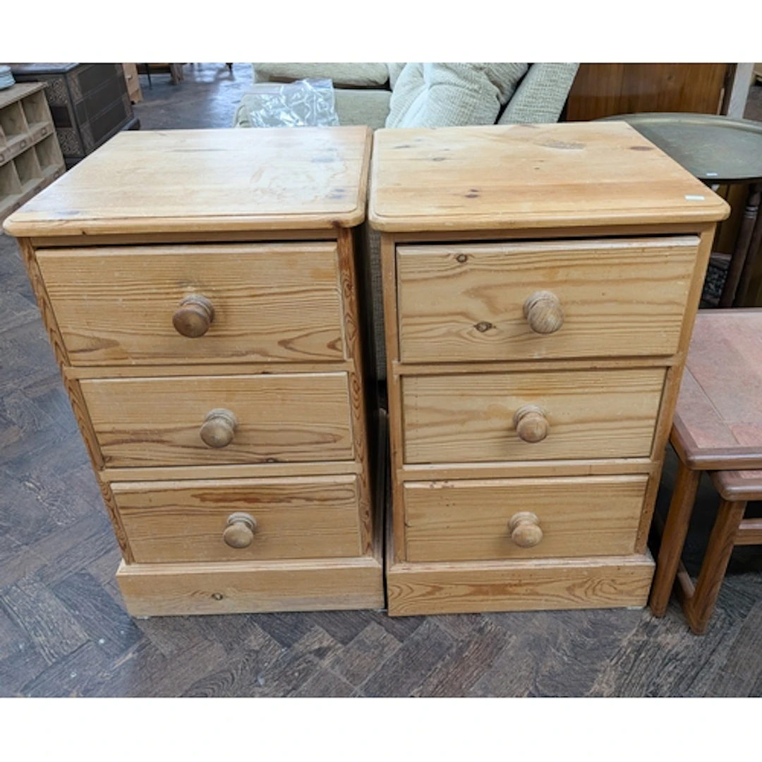 Pair of pine three drawer bedside cabinets