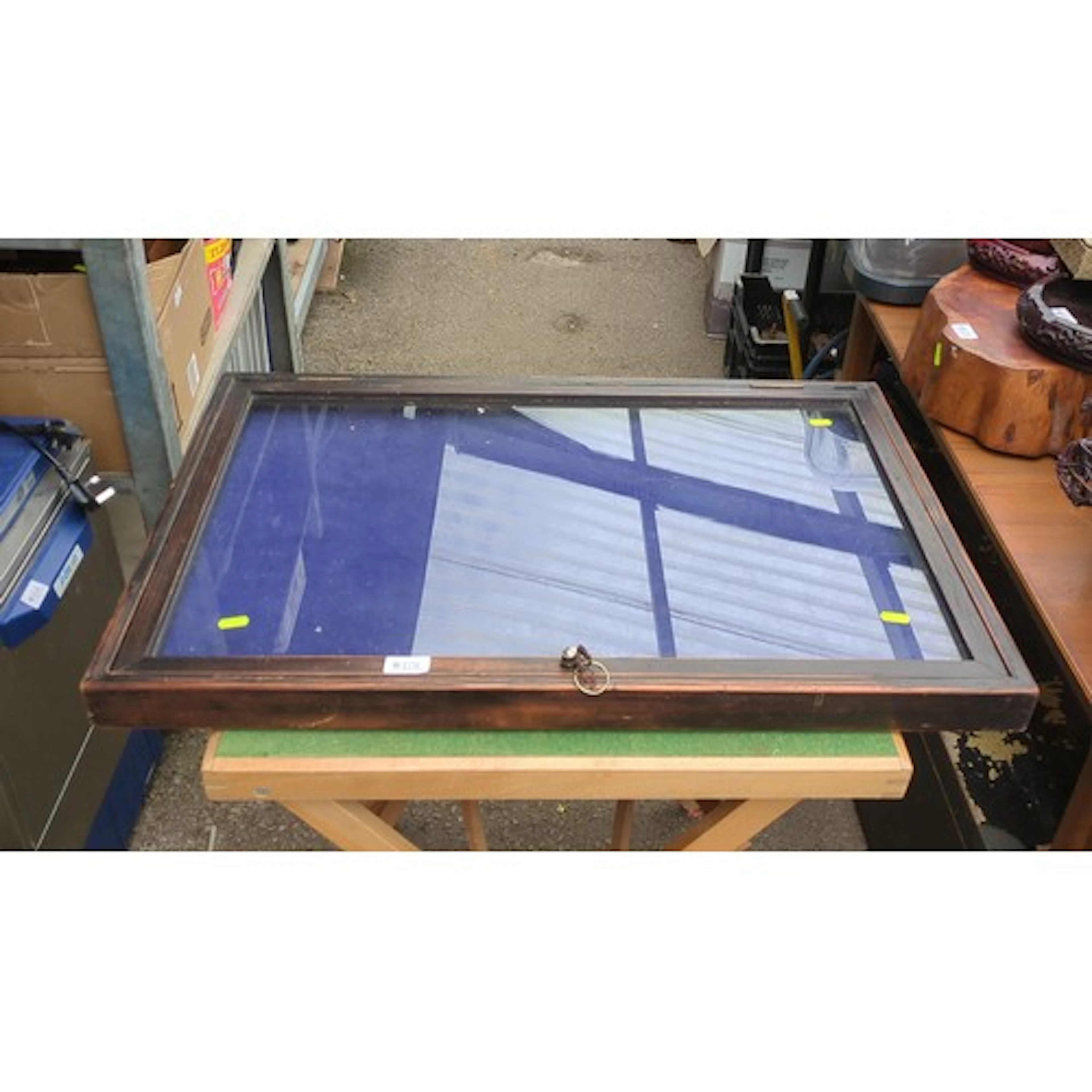 Large glazed tabletop display case in stained hardwood, the ...