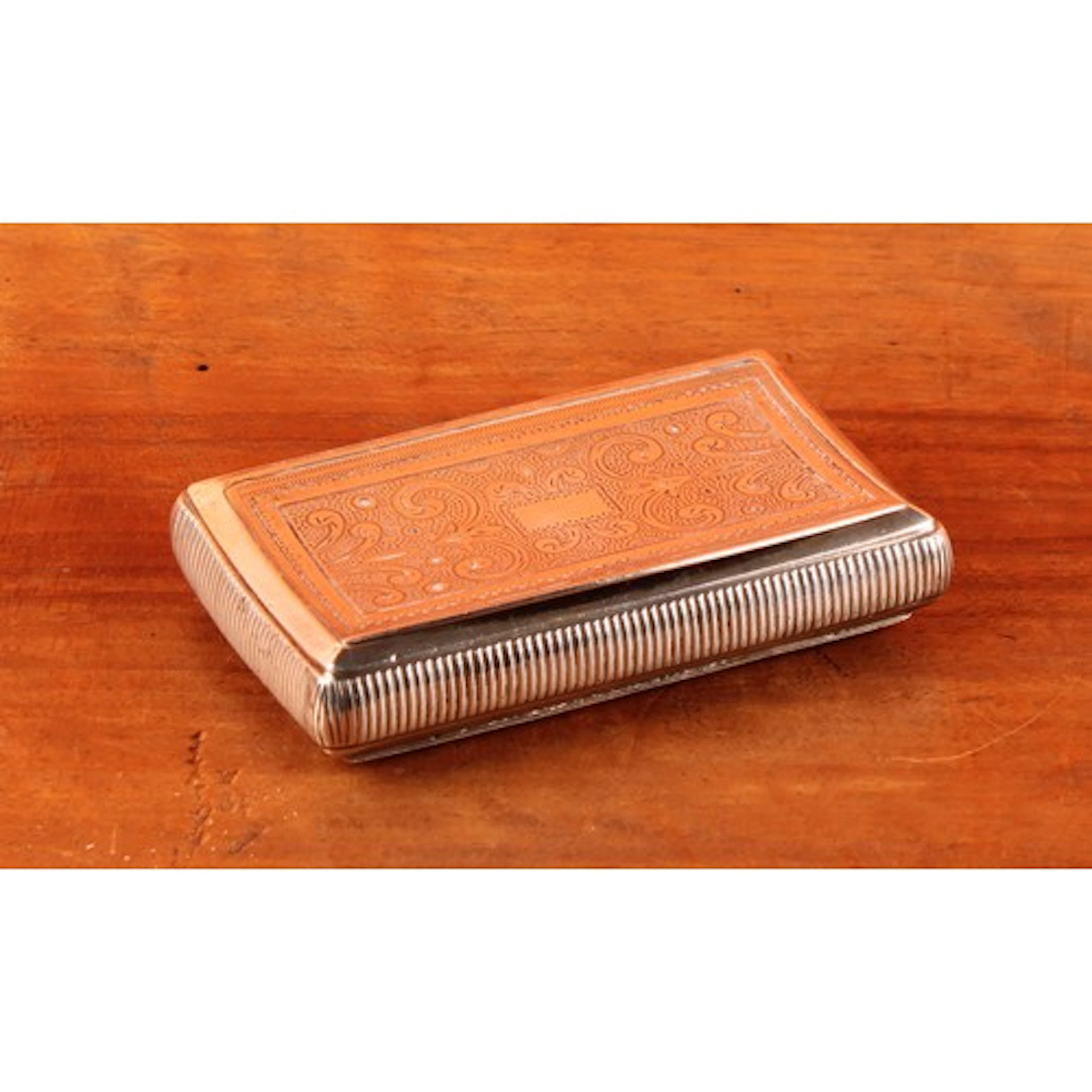 An early 19th century French silver curved rectangular snuff...