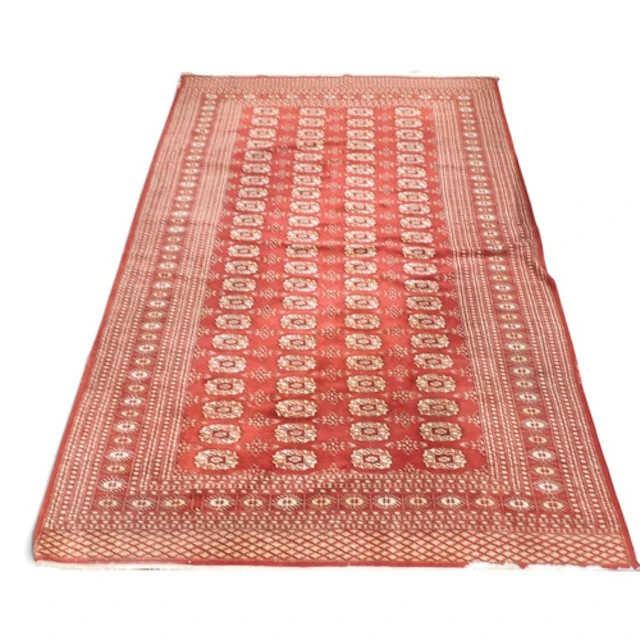A red ground Tekke rug with four rows of twenty-two geometri...