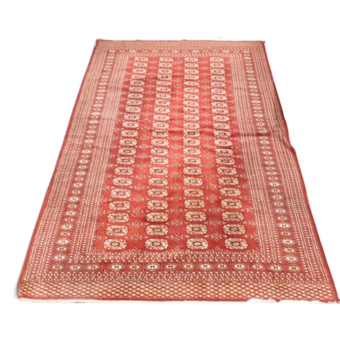 A red ground Tekke rug with four rows of twenty-two geometri...