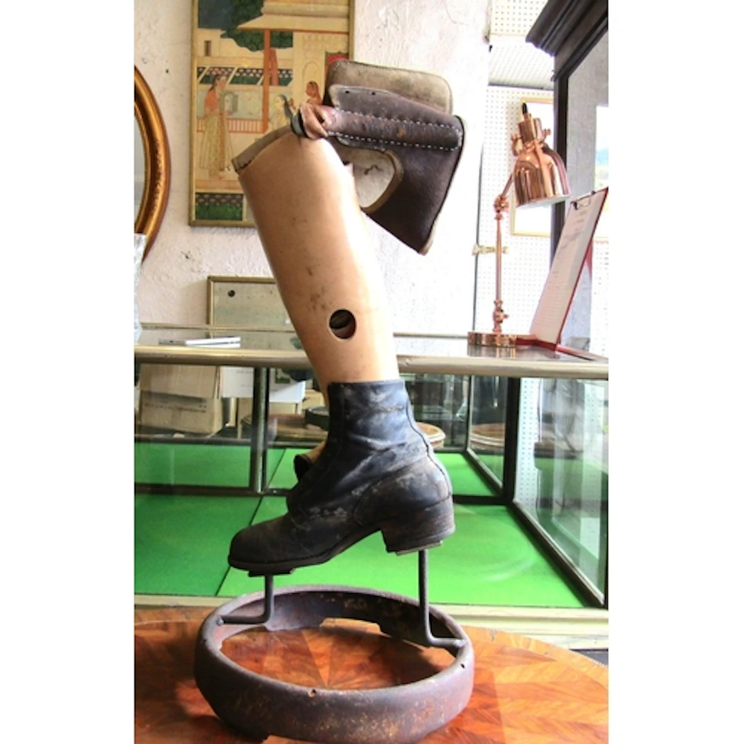 Old Amputee Leg with Booth Now Mounted on Metal Circular Sta...