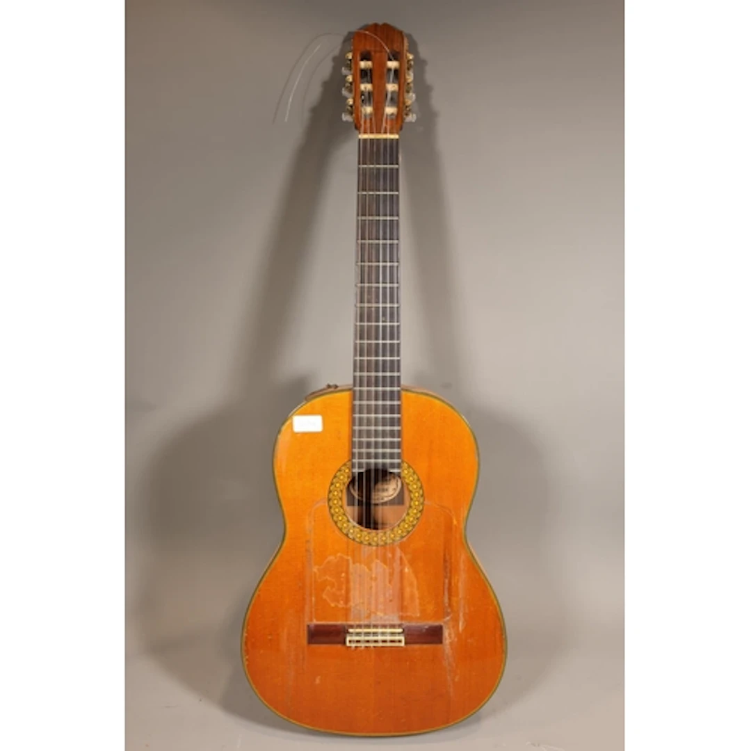 Six string acoustic guitar with case, made in Japan