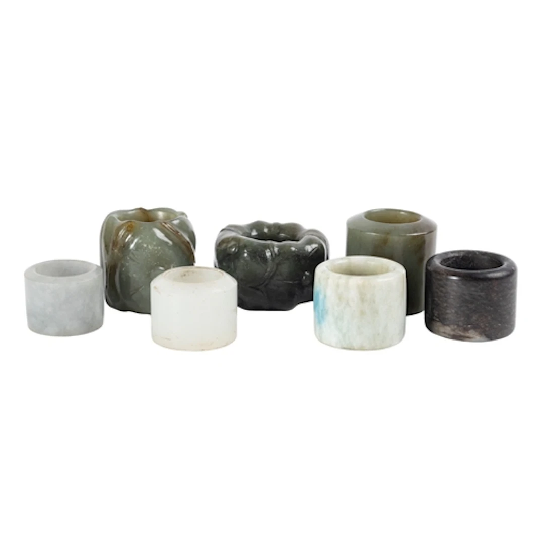 A group of seven jade archer's rings, 20th century two carve...
