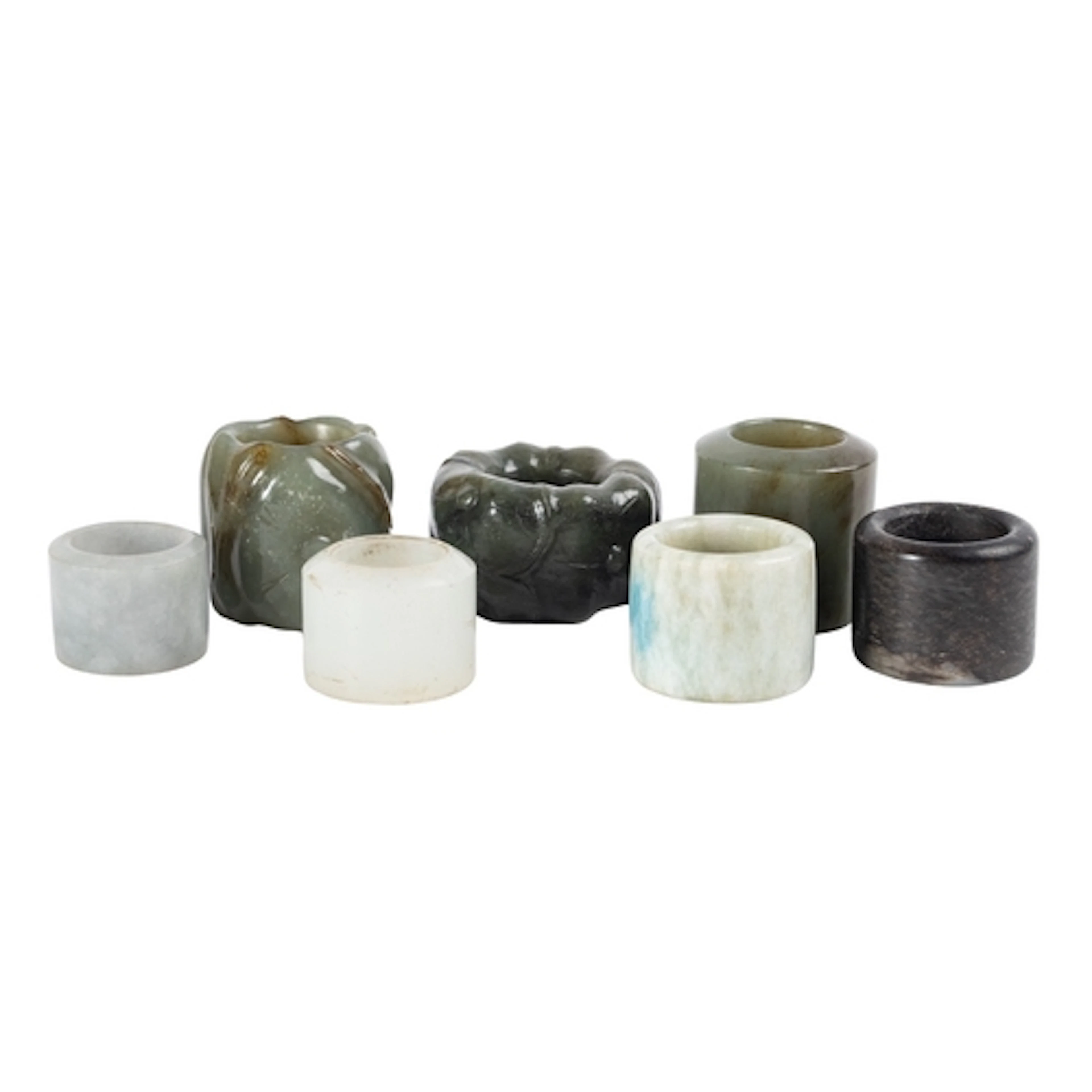 A group of seven jade archer's rings, 20th century two carve...
