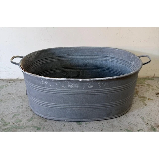 A galvanised steel tub with handles to sides. Height 30cm 85...