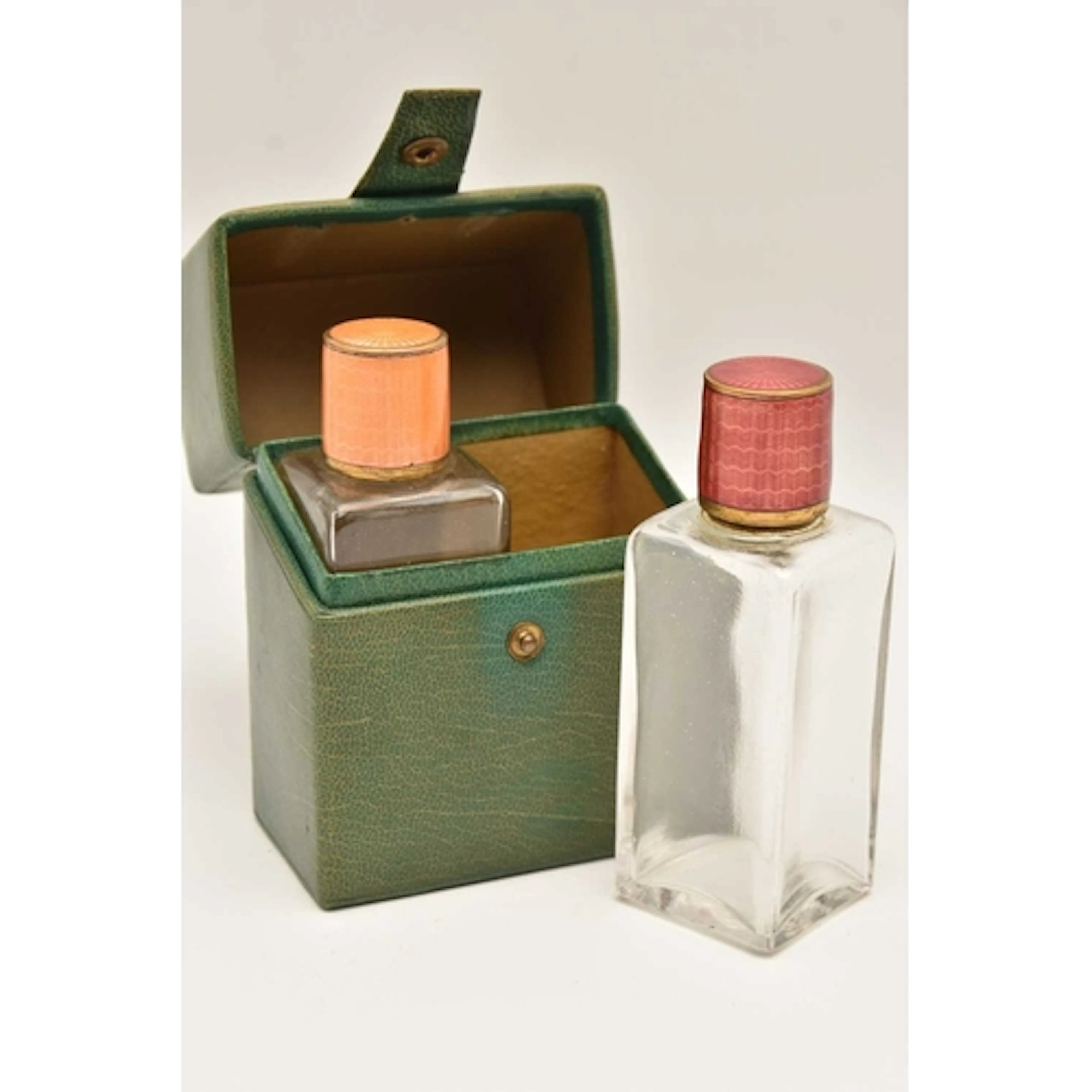 A TRAVELLING PERFUME SET, comprising of two glass bottles, e...