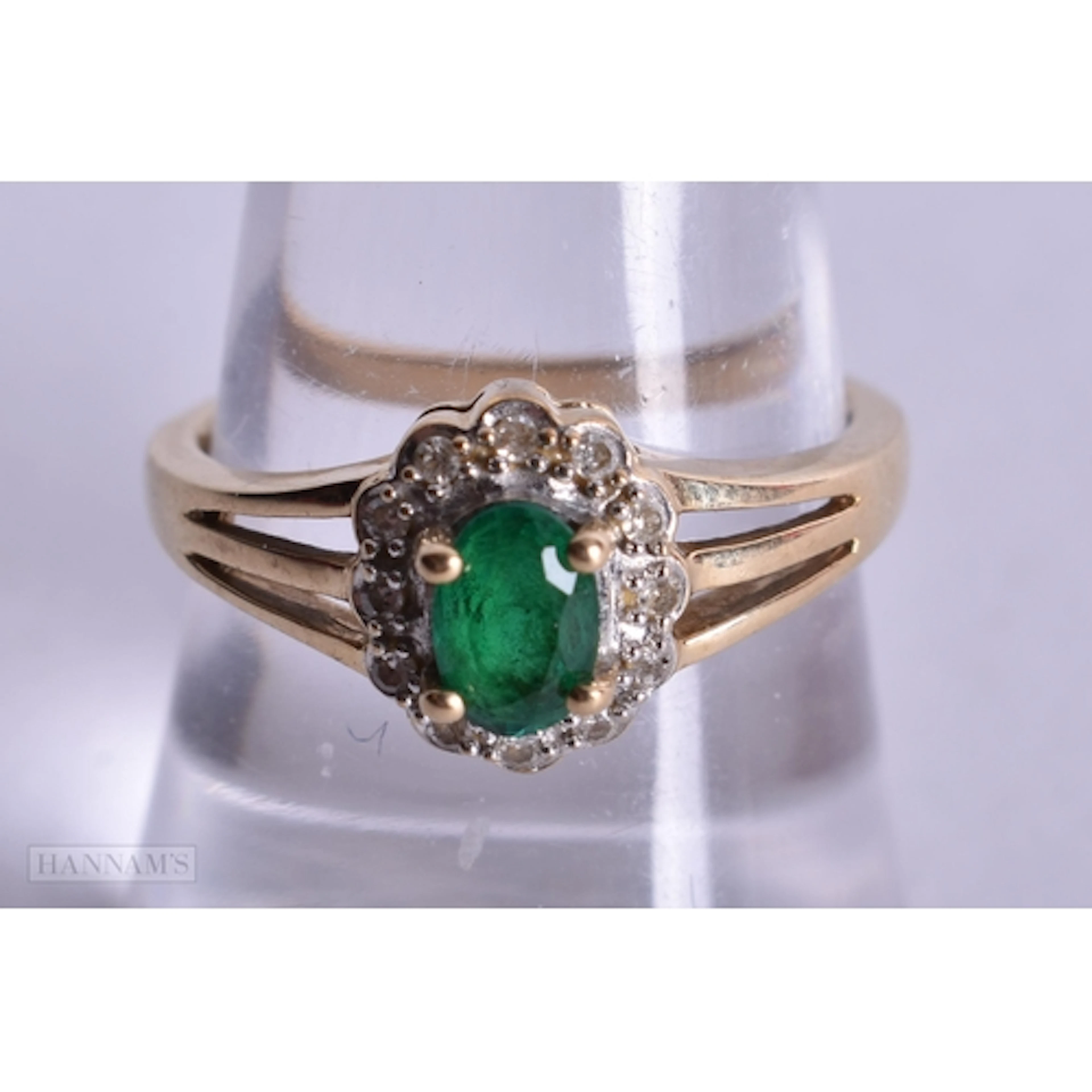 9ct emerald and diamond halo cluster ring (2.7g). P.