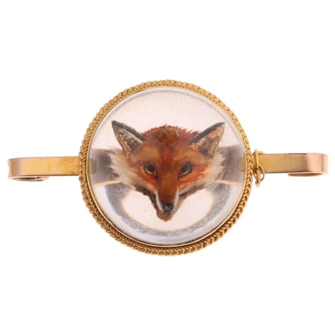 An Antique 9ct gold Essex Crystal 'Fox Mask' bar brooch, the...