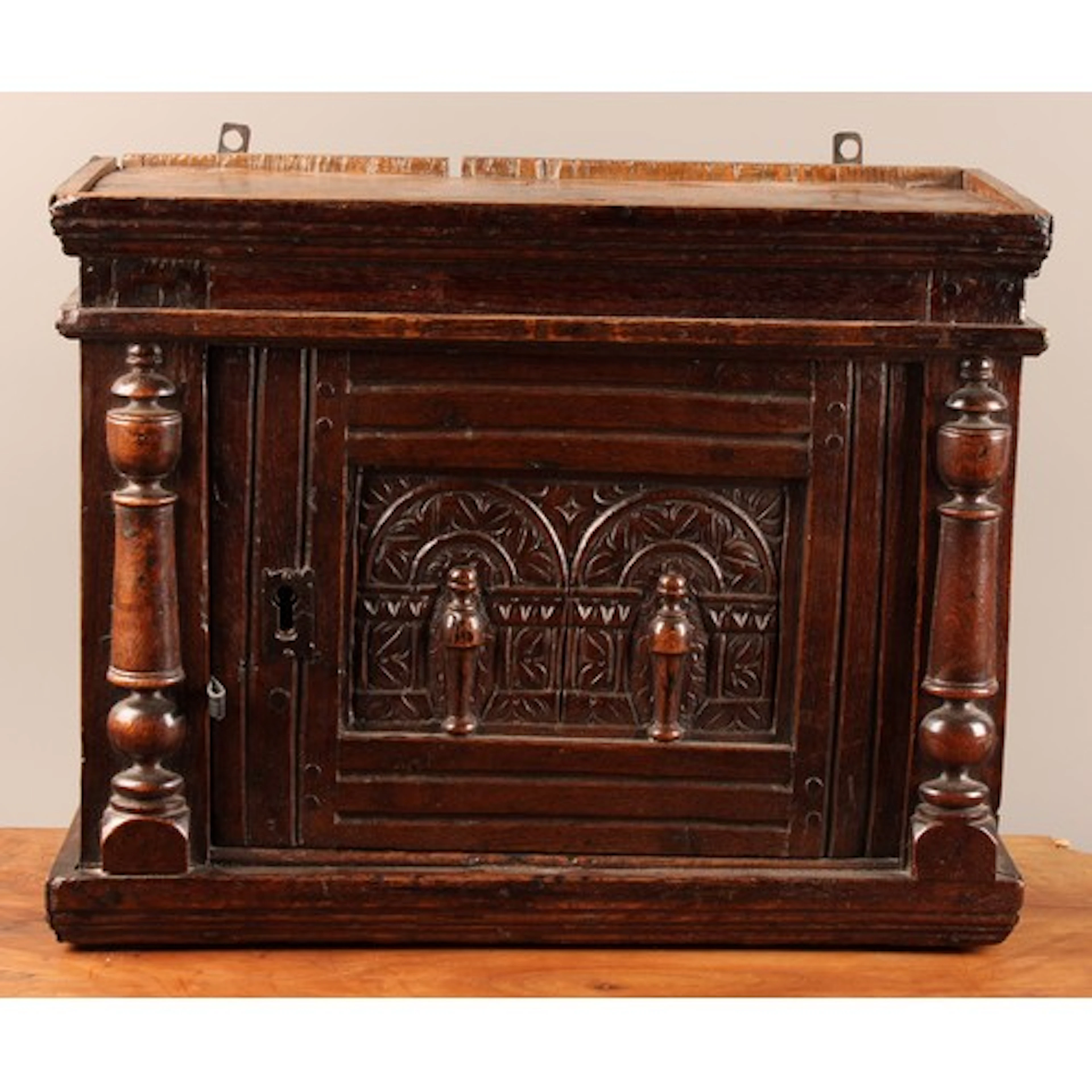 A 17th century oak and pine mural spice or provision cupboar...