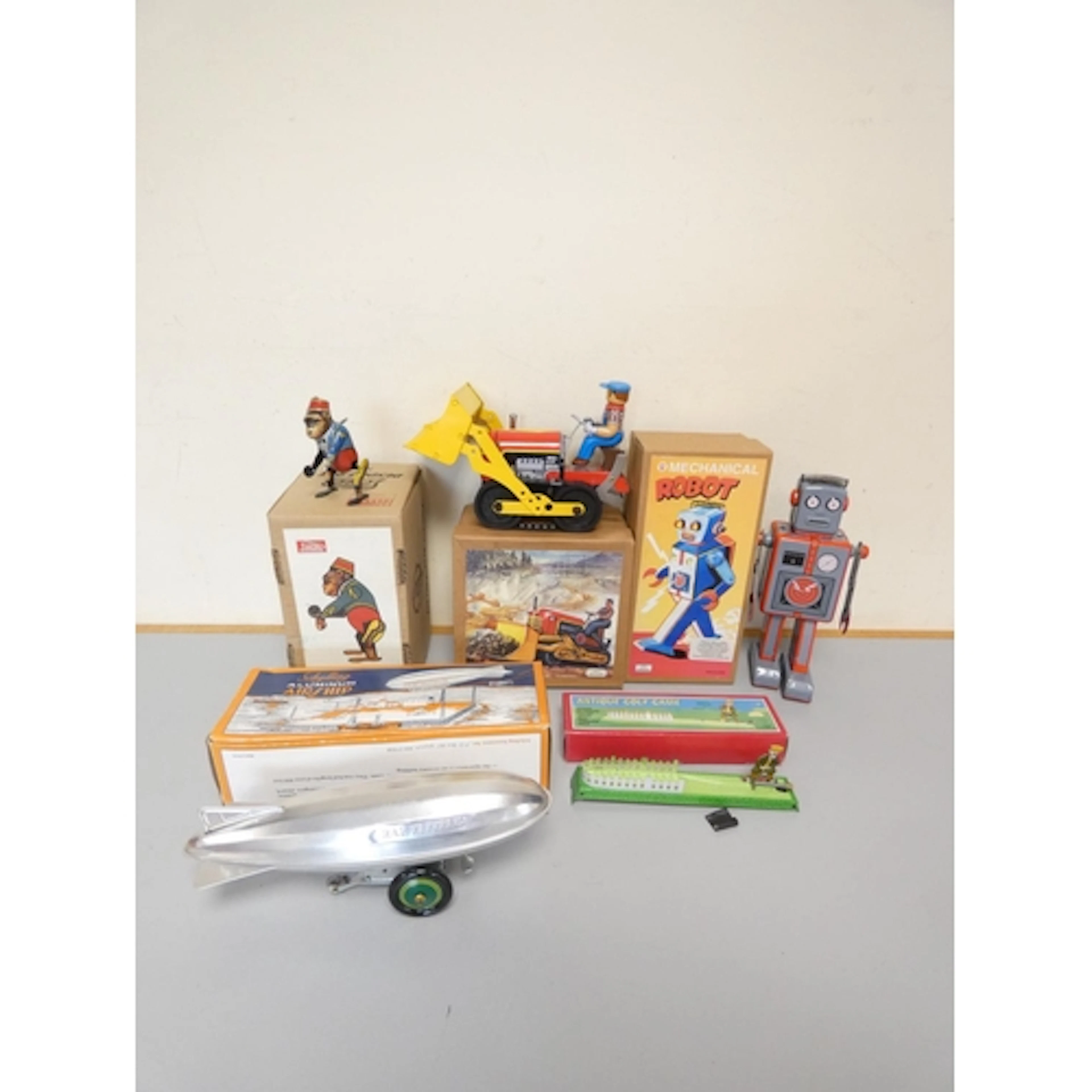 Group of modern tin-plate clockwork toys to include a Schyll...