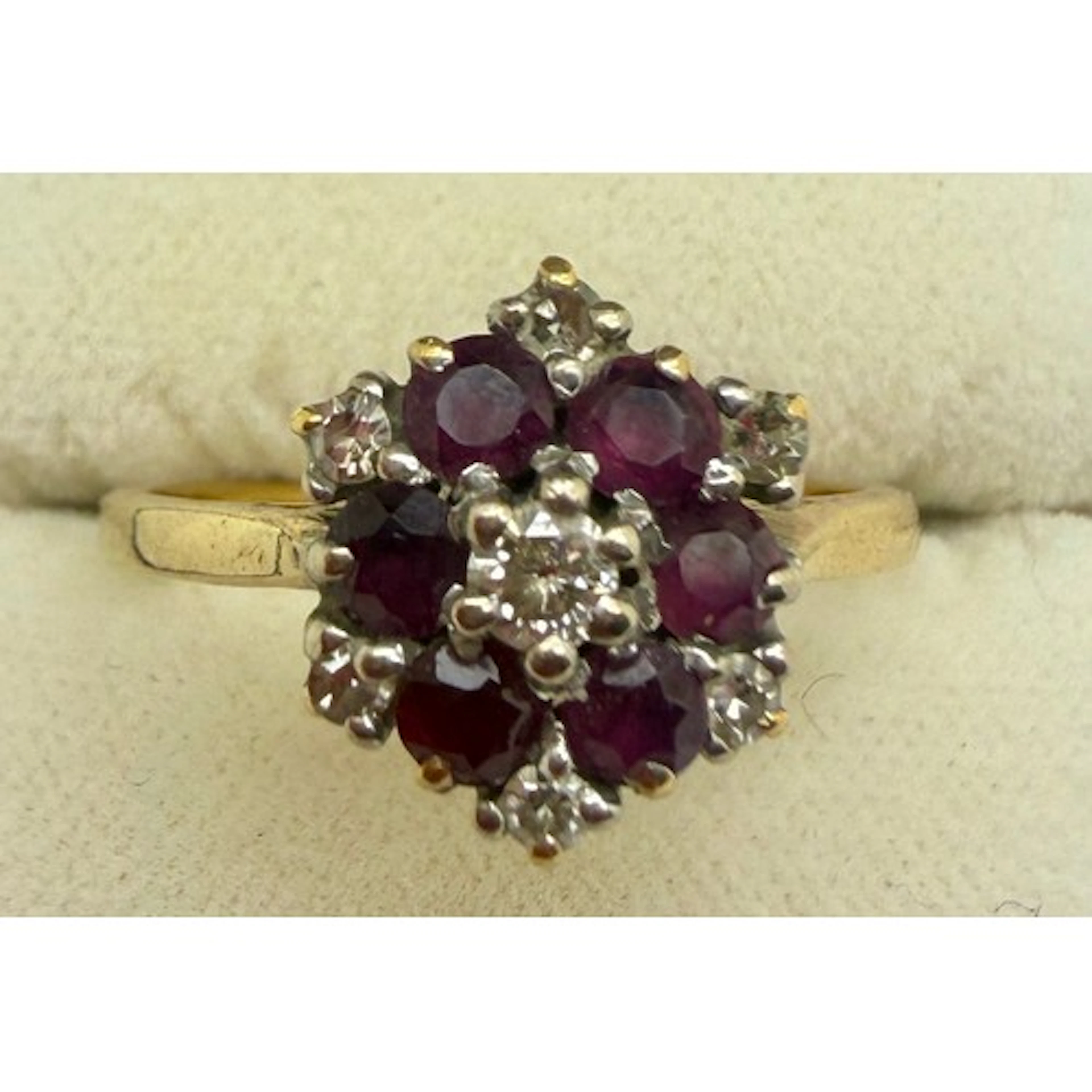 An 18 carat yellow gold cluster ring set with pink stones an...