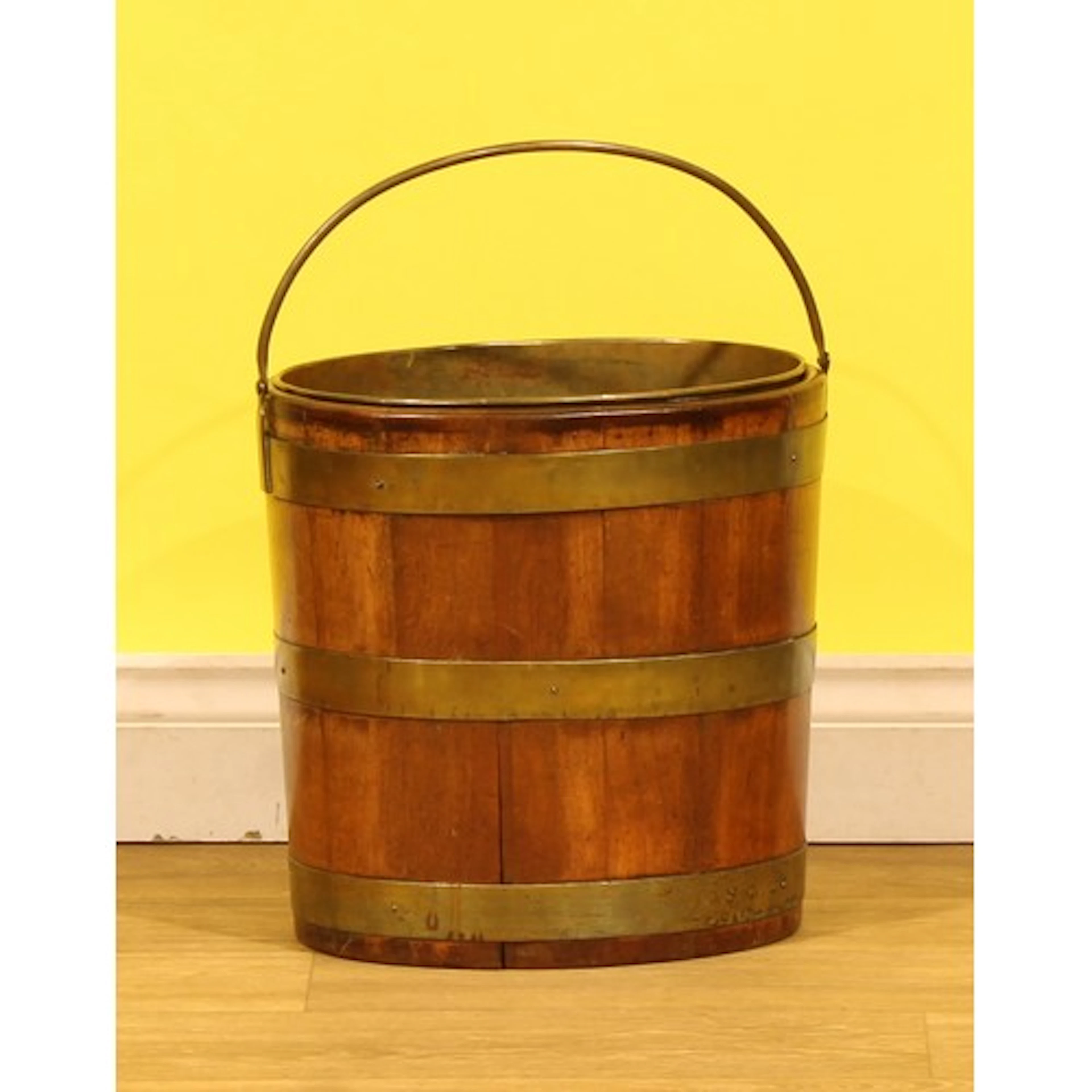 A 19th century brass bound mahogany peat bucket, 34.5cm high...