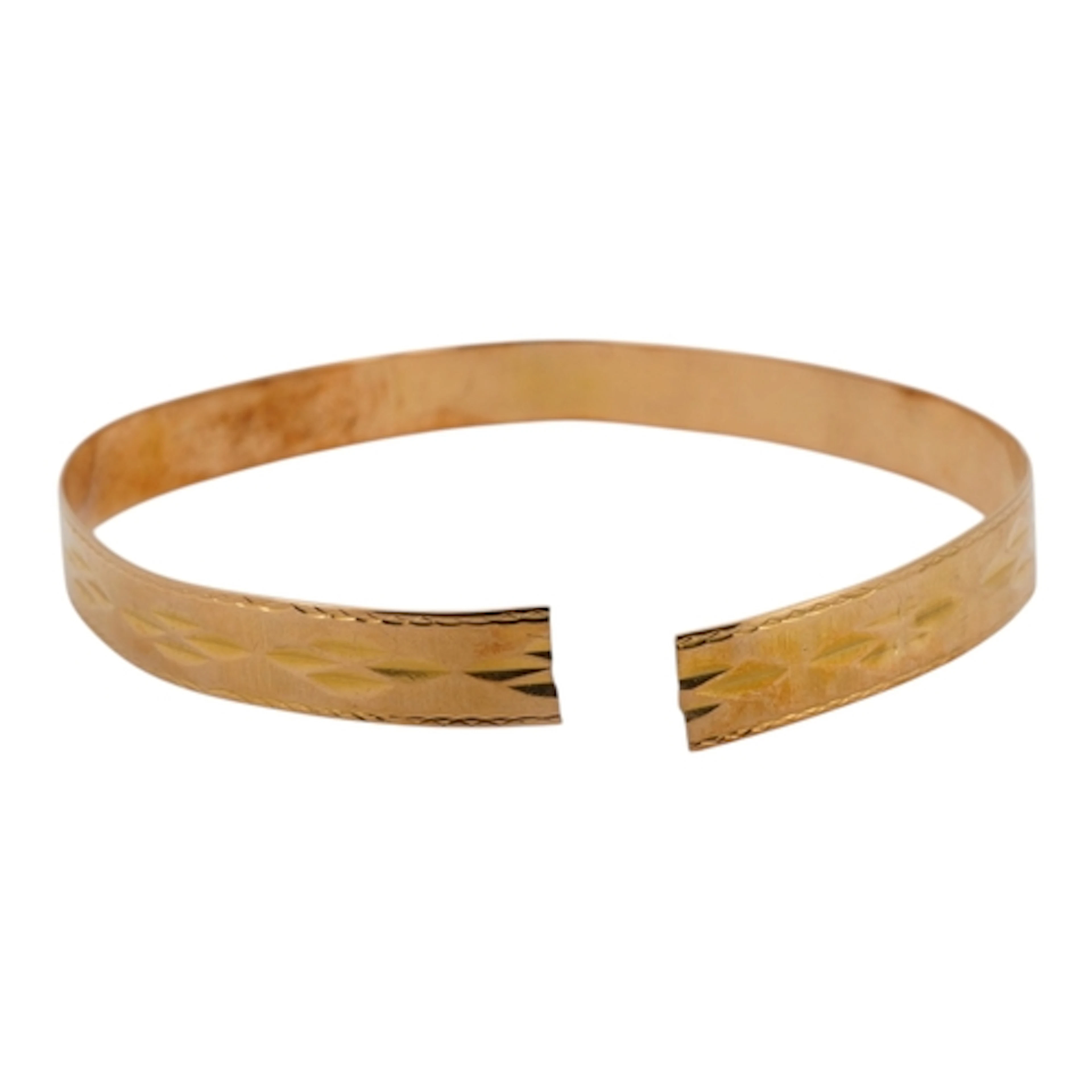 An unmarked bright cut engraved yellow metal bangle(cut), 10...