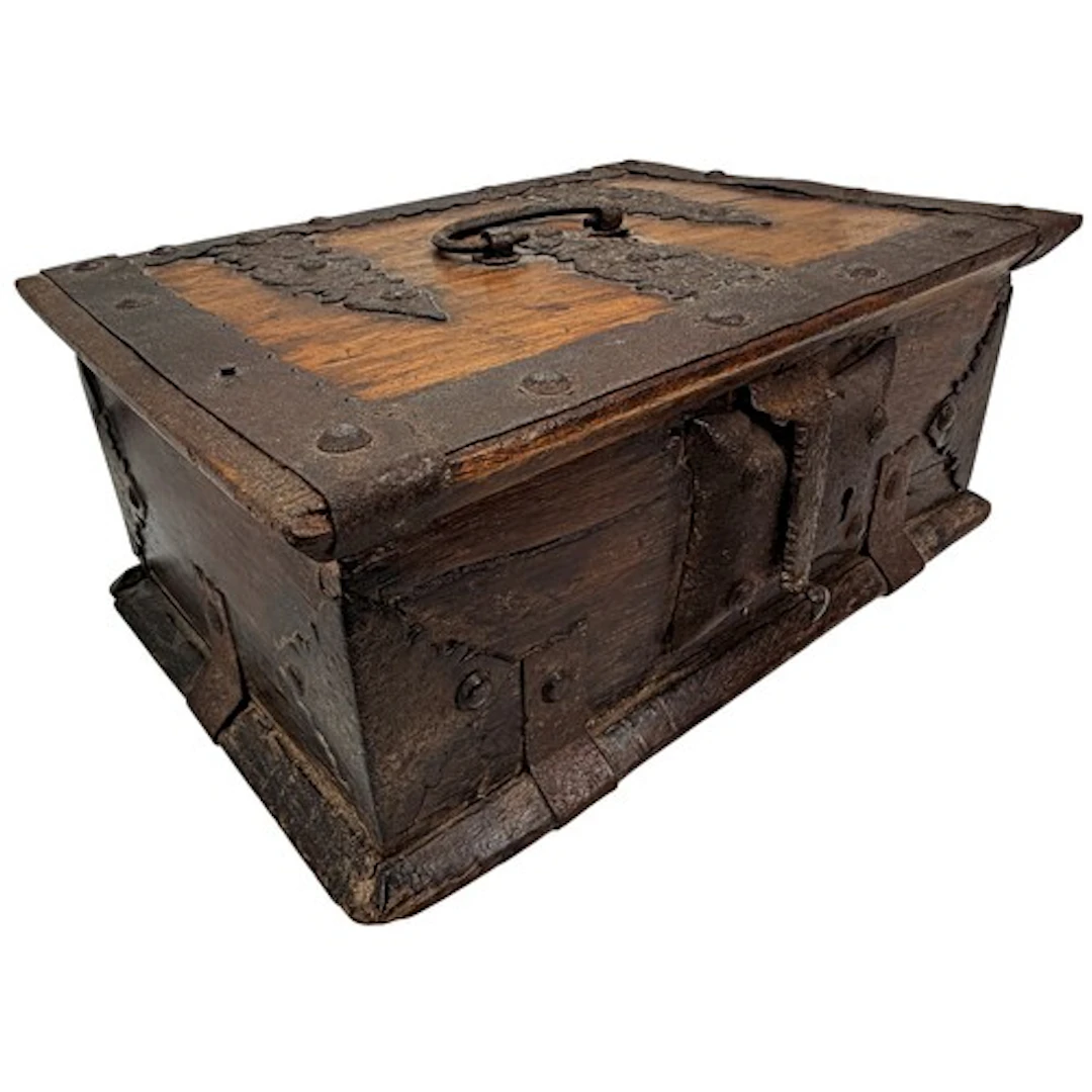 A rectangular oak casket of robust construction, the hinged ...