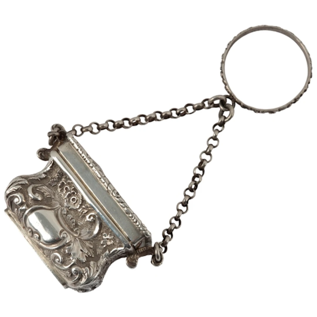 A Victorian novelty silver vinaigrette, modelled as a handba...