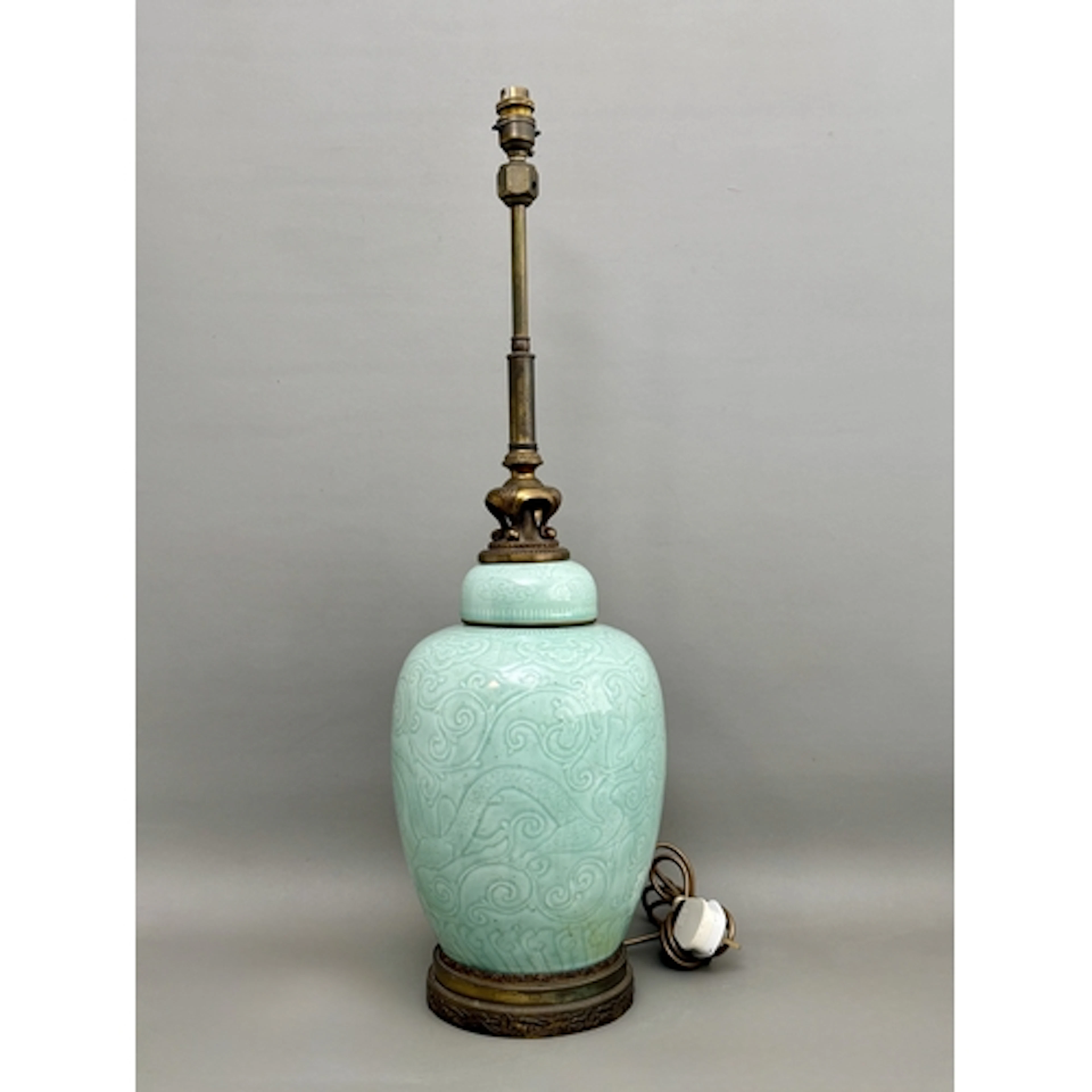 A Chinese celadon ginger jar style table lamp - with a carve...