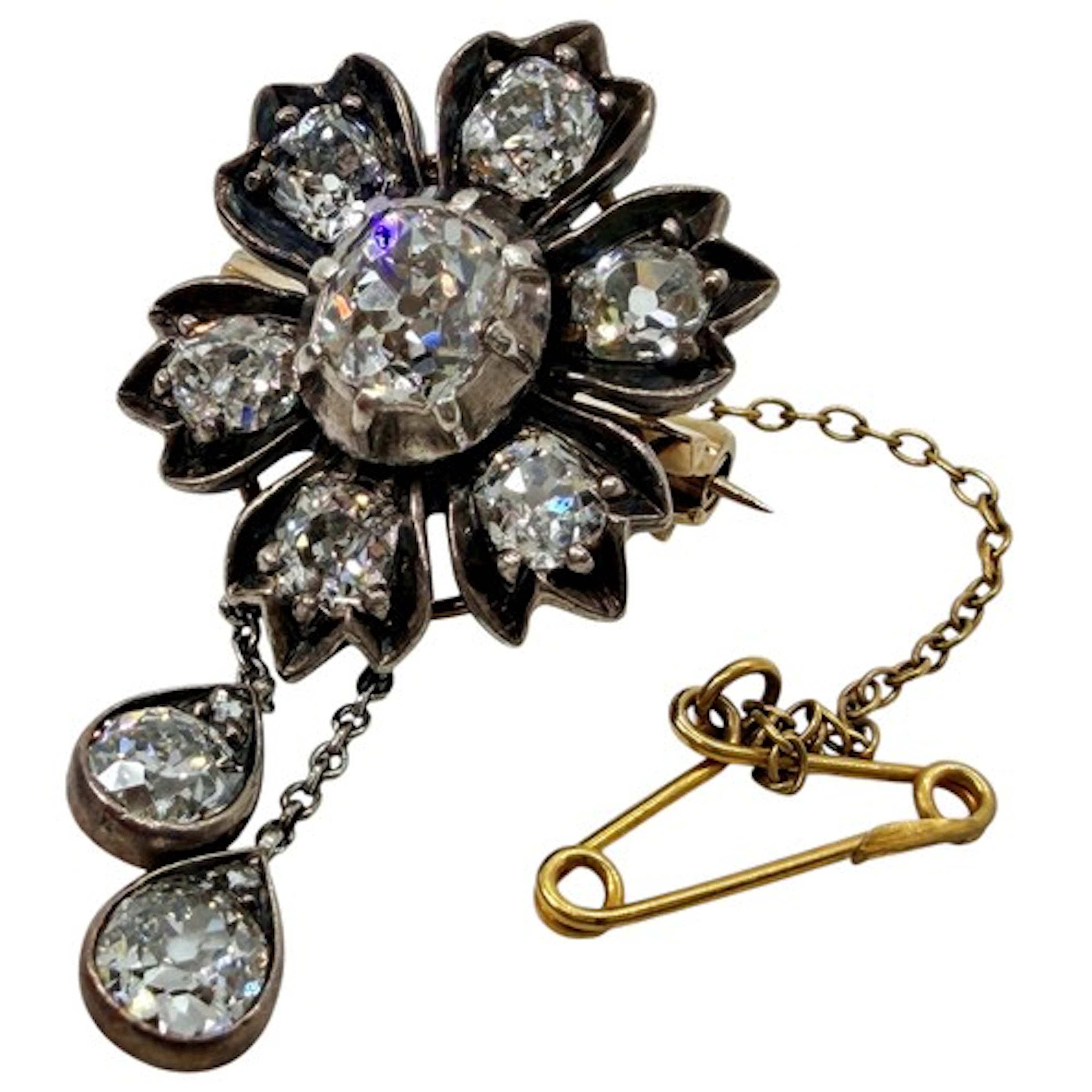A 19th century diamond floret pendant/brooch, centred with a...