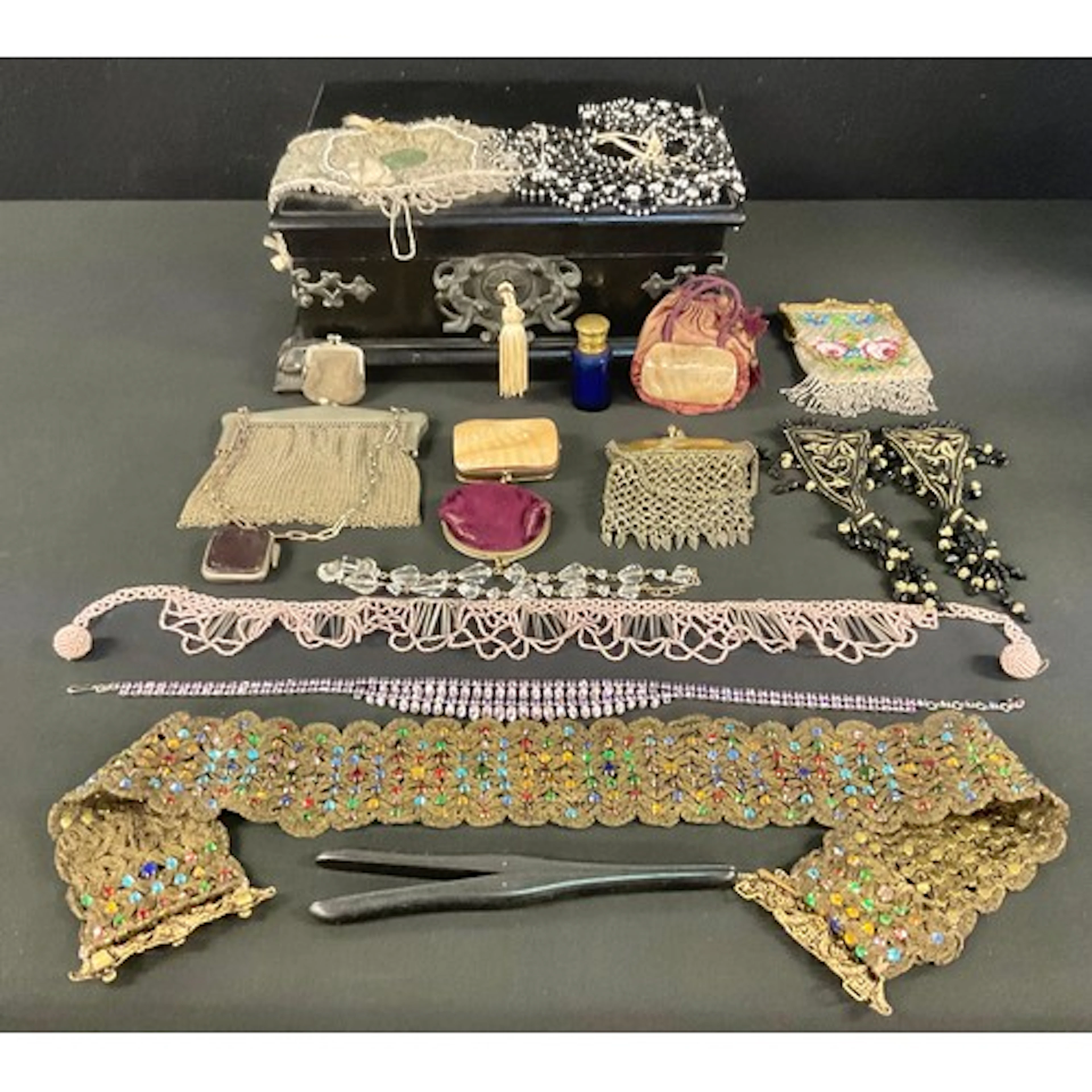 An early 20th century belt embellished with colourful glass ...