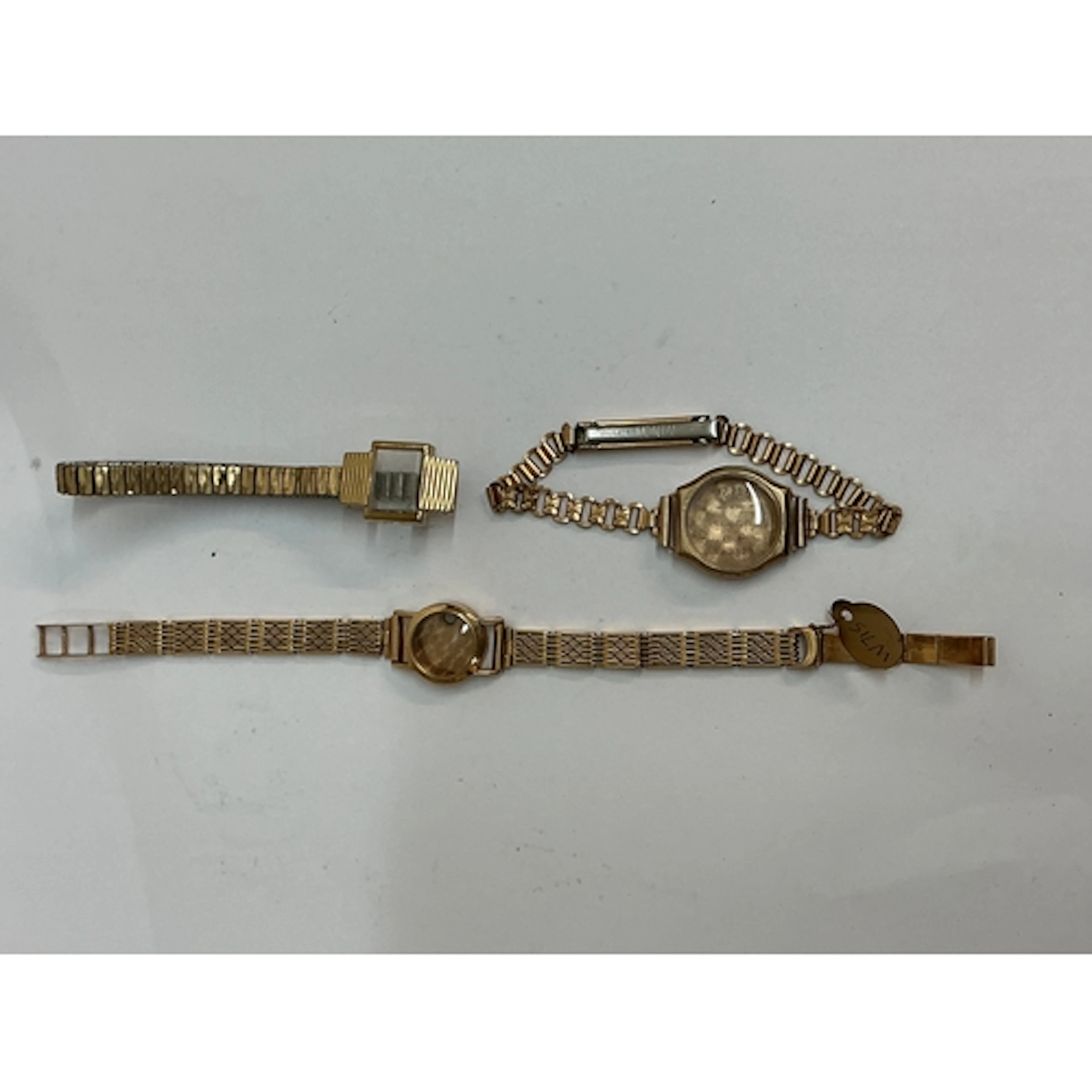 A 9ct gold, empty ladies wristwatch on bracelet strap, plus ...