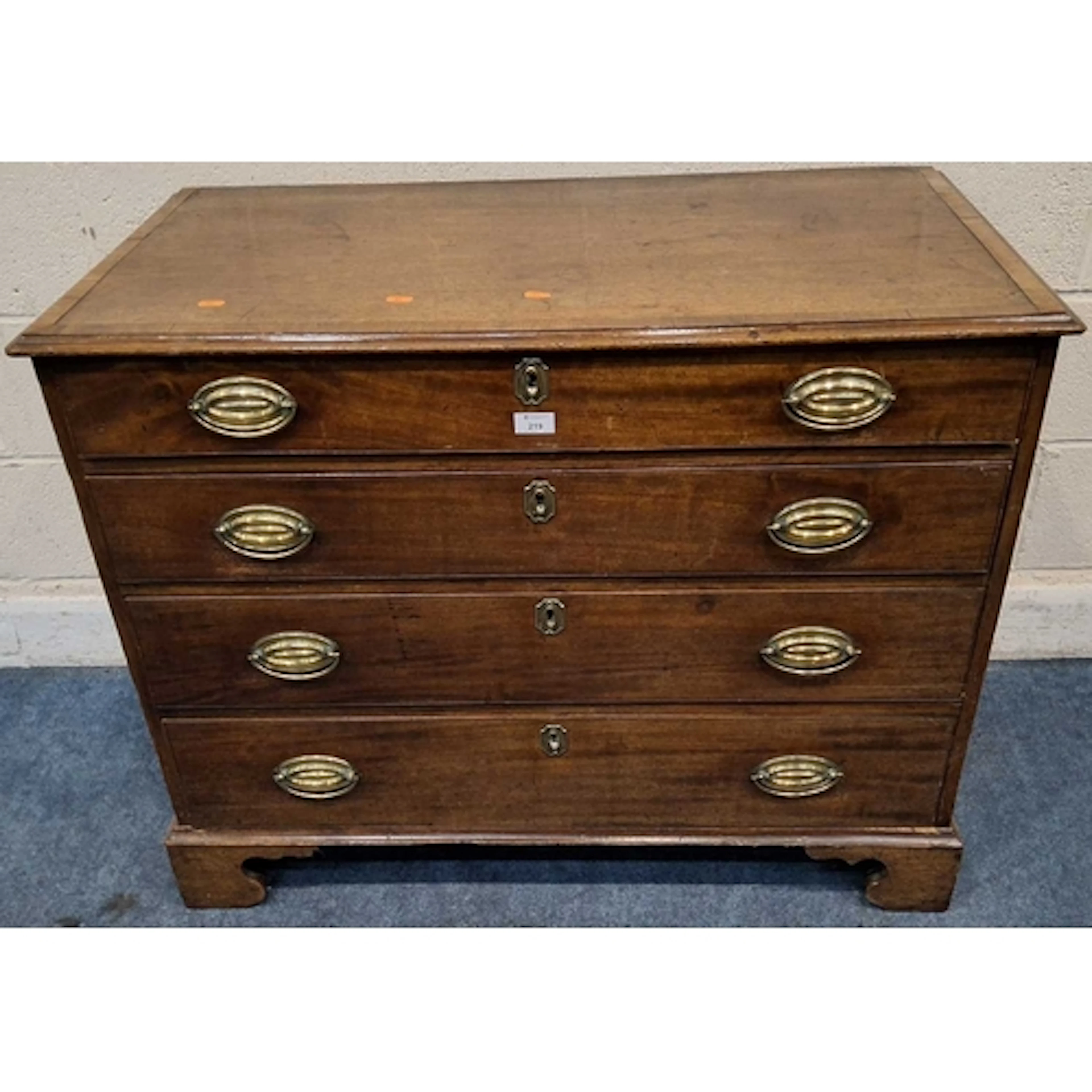 A GEORGIAN MAHOGANY CHEST OF FOUR GRADUATED DRAWERS, raised ...