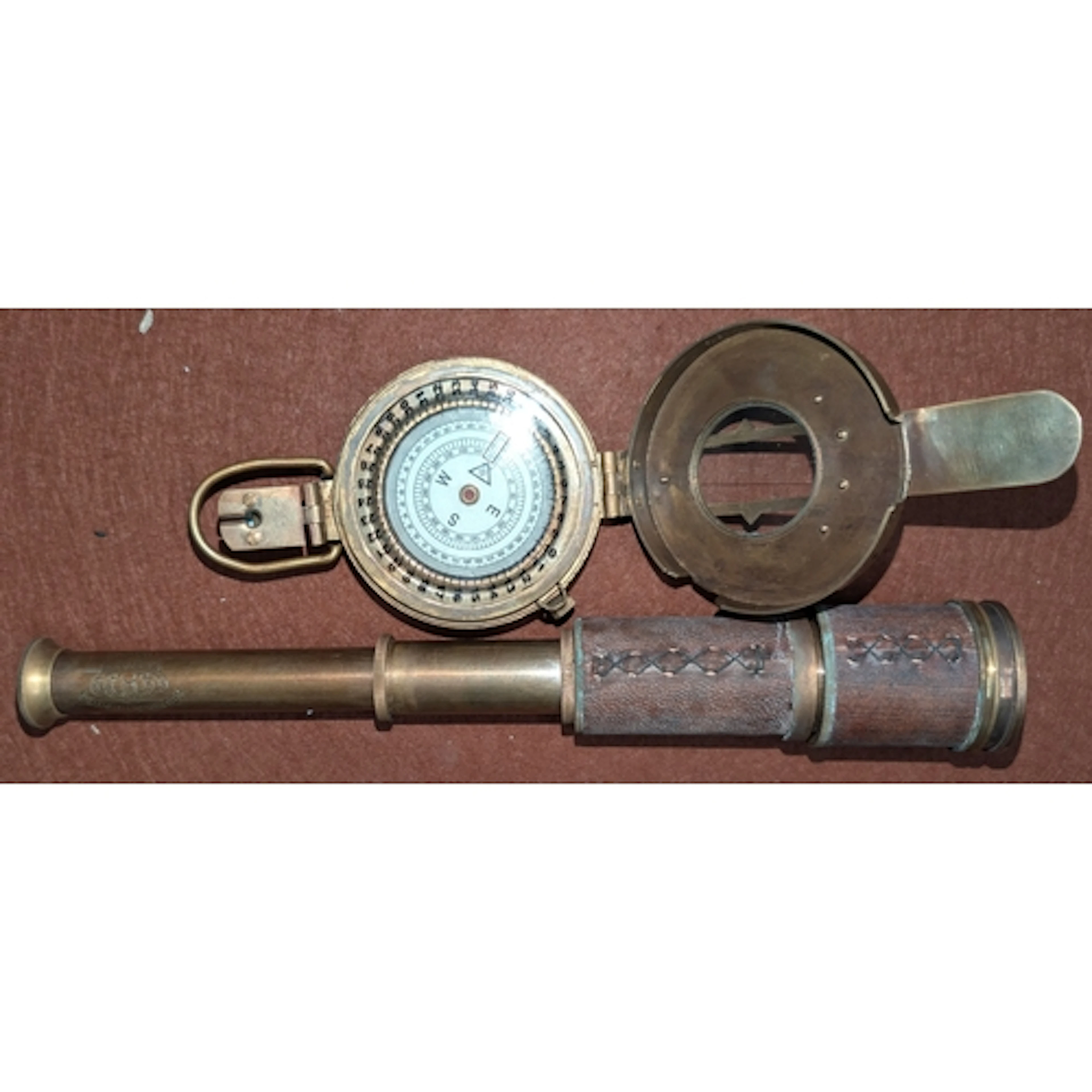 A vintage-style telescope and compass.