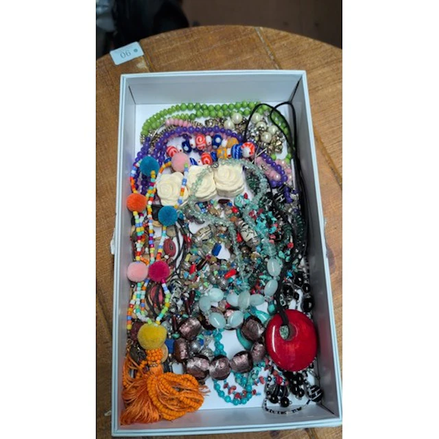 A collection of costume jewellery necklaces and bead strands...
