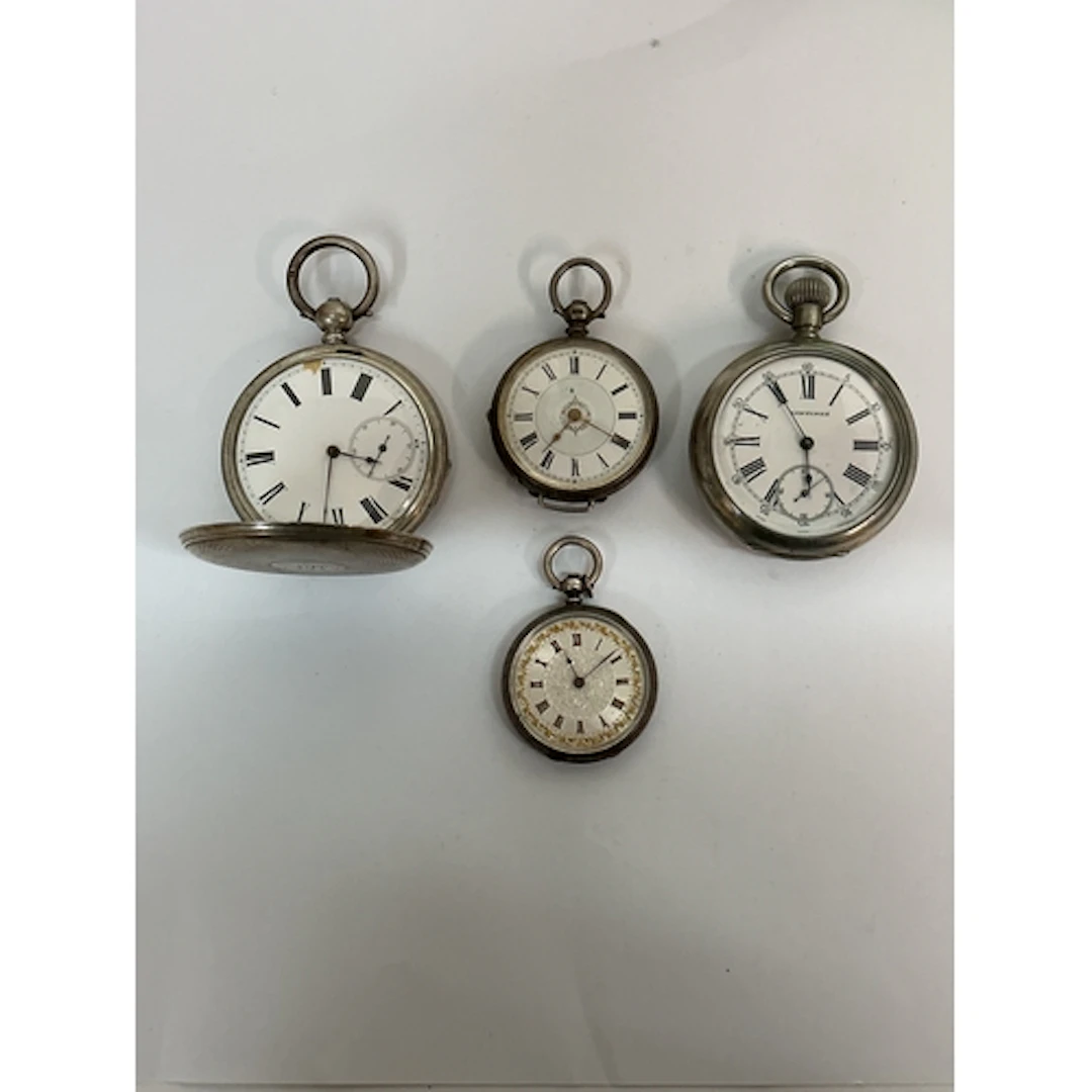 A Longines pocket watch plus three other silver cased exampl...