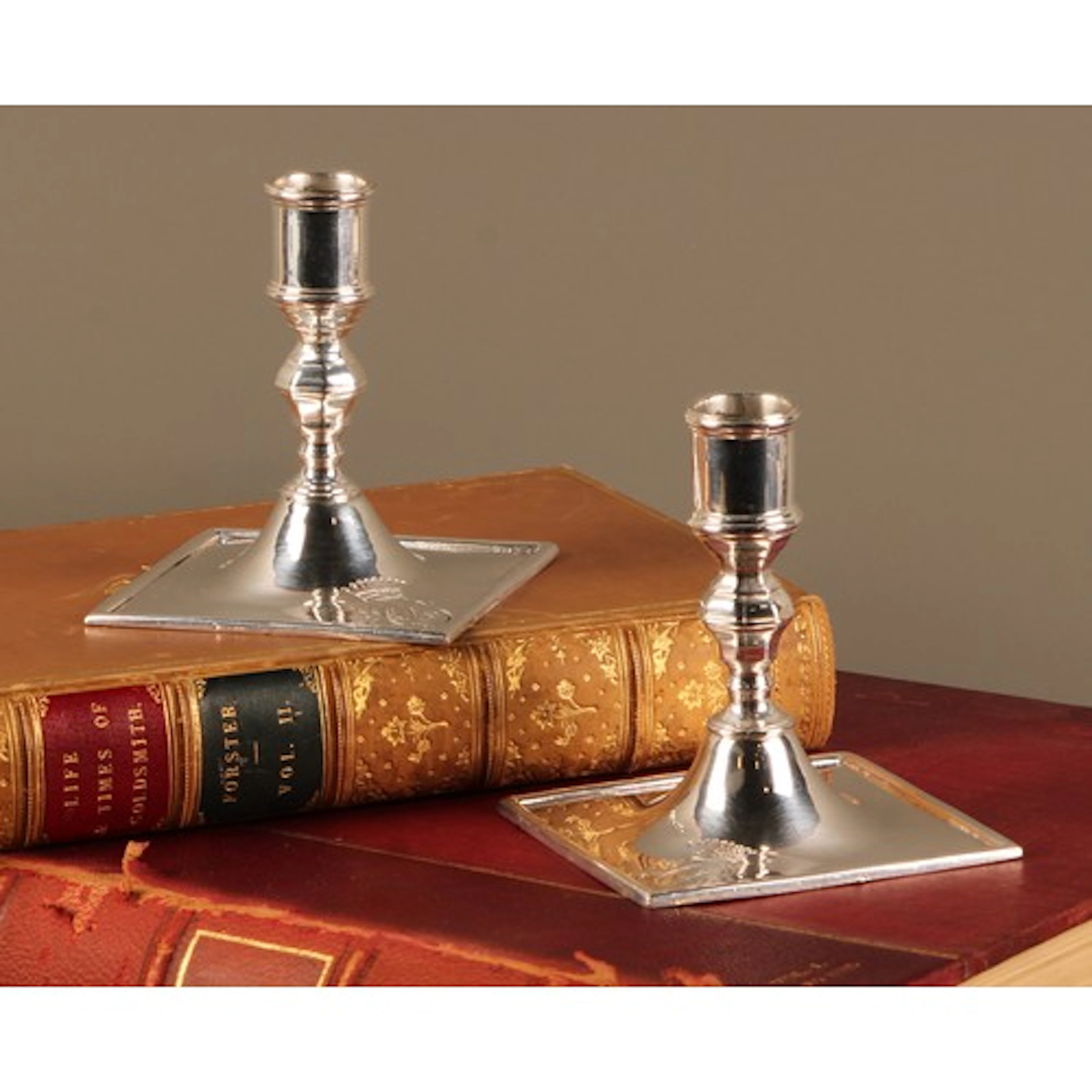 A pair of 19th century Continental silvered metal candlestic...
