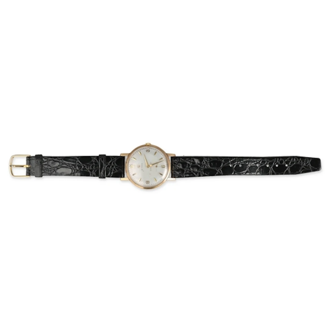 A 9CT GOLD CYMA WATCH With black leather strap. ...