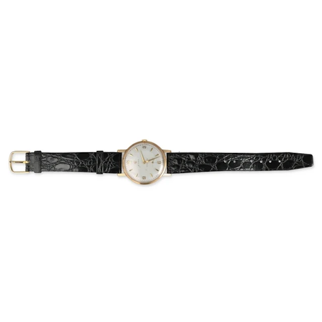 A 9CT GOLD CYMA WATCH With black leather strap. ...