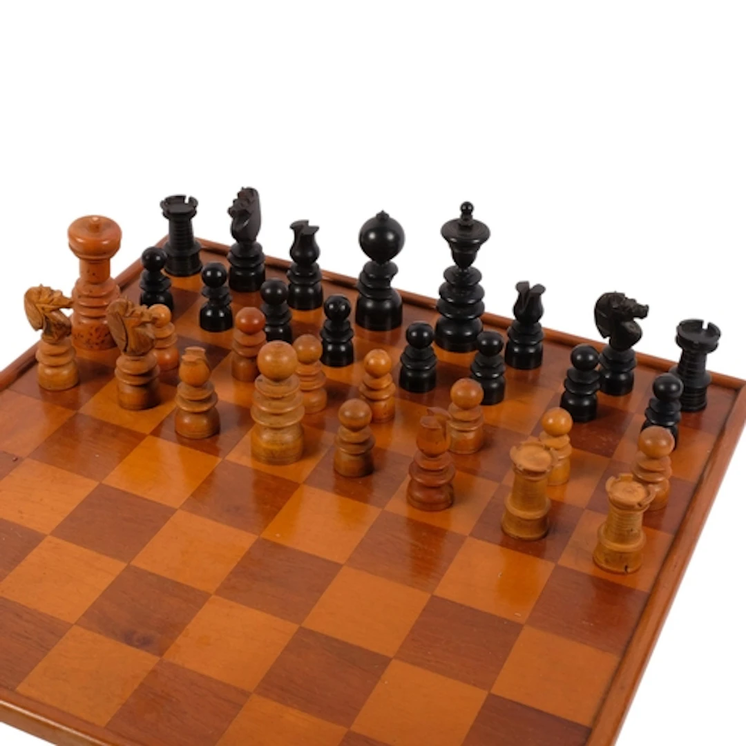 A Vintage turned wooden chess set, with similar games board