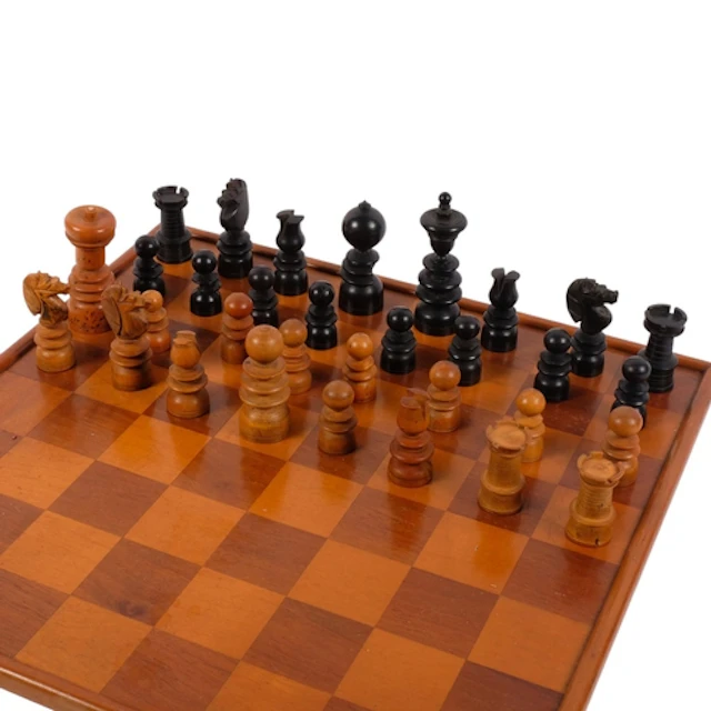 A Vintage turned wooden chess set, with similar games board